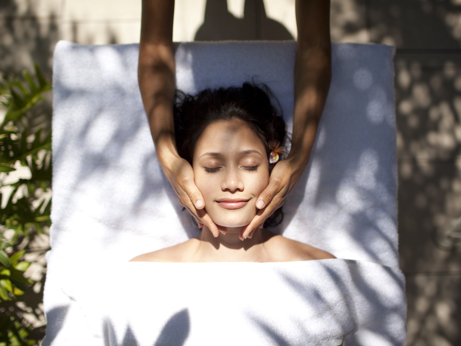 Guest receiving a face massage