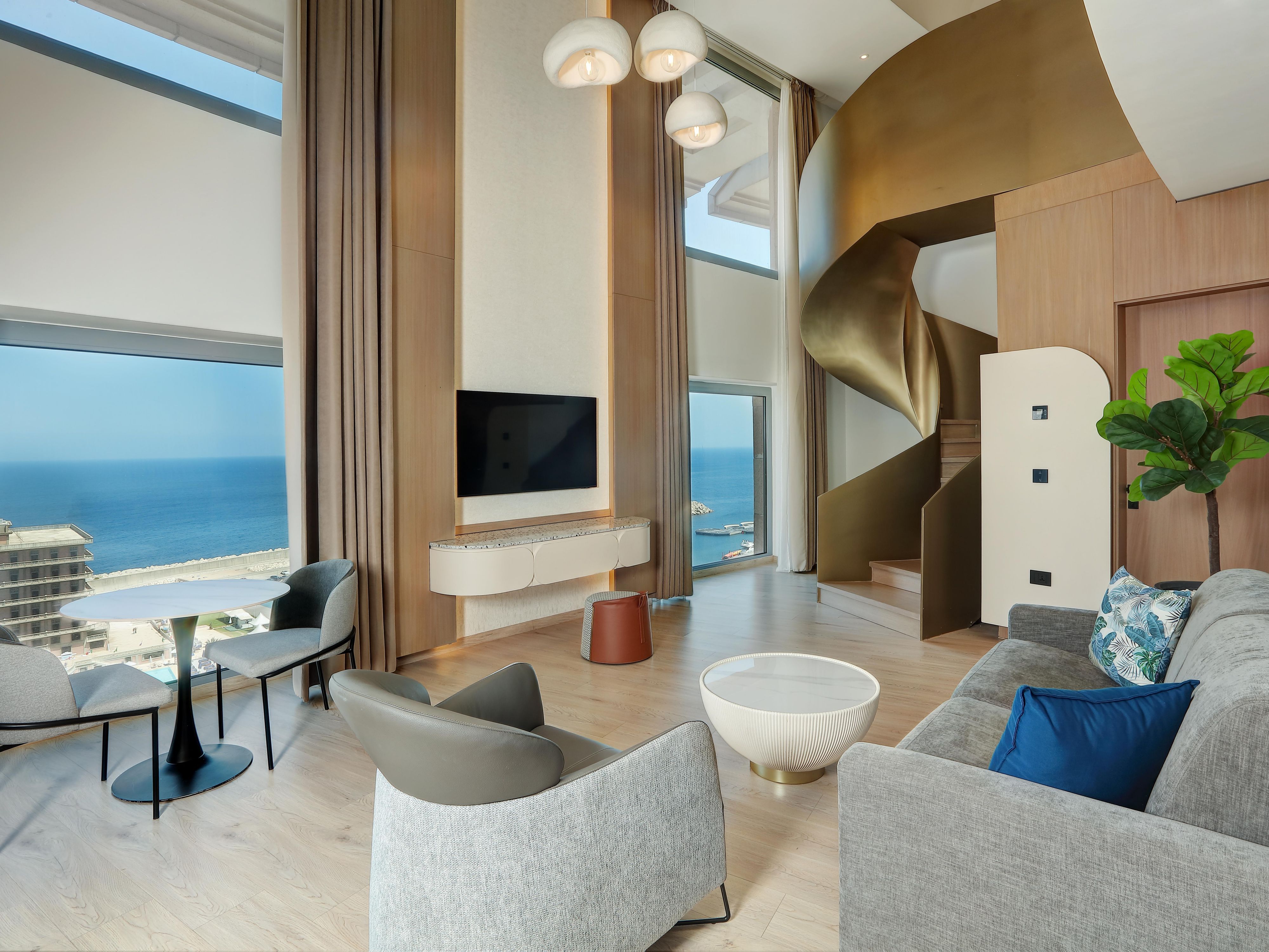  Unwind with sea views in our Duplex Suites’ living area