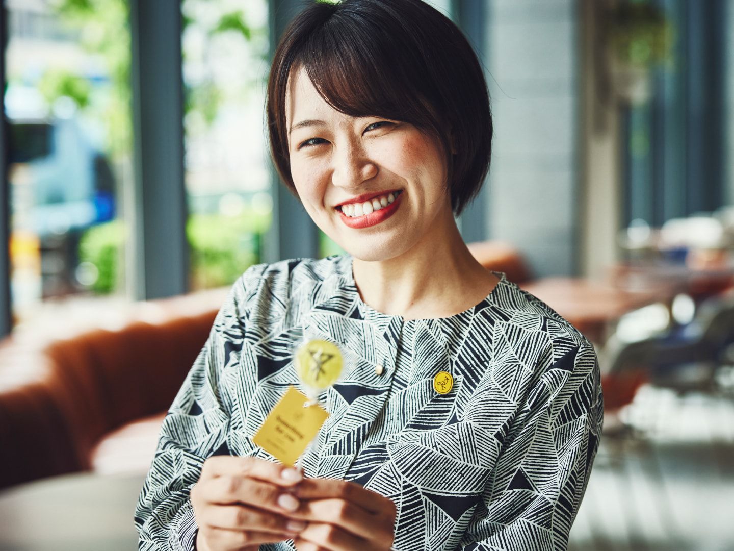 Warm image of a welcoming receptionist at a voco hotel