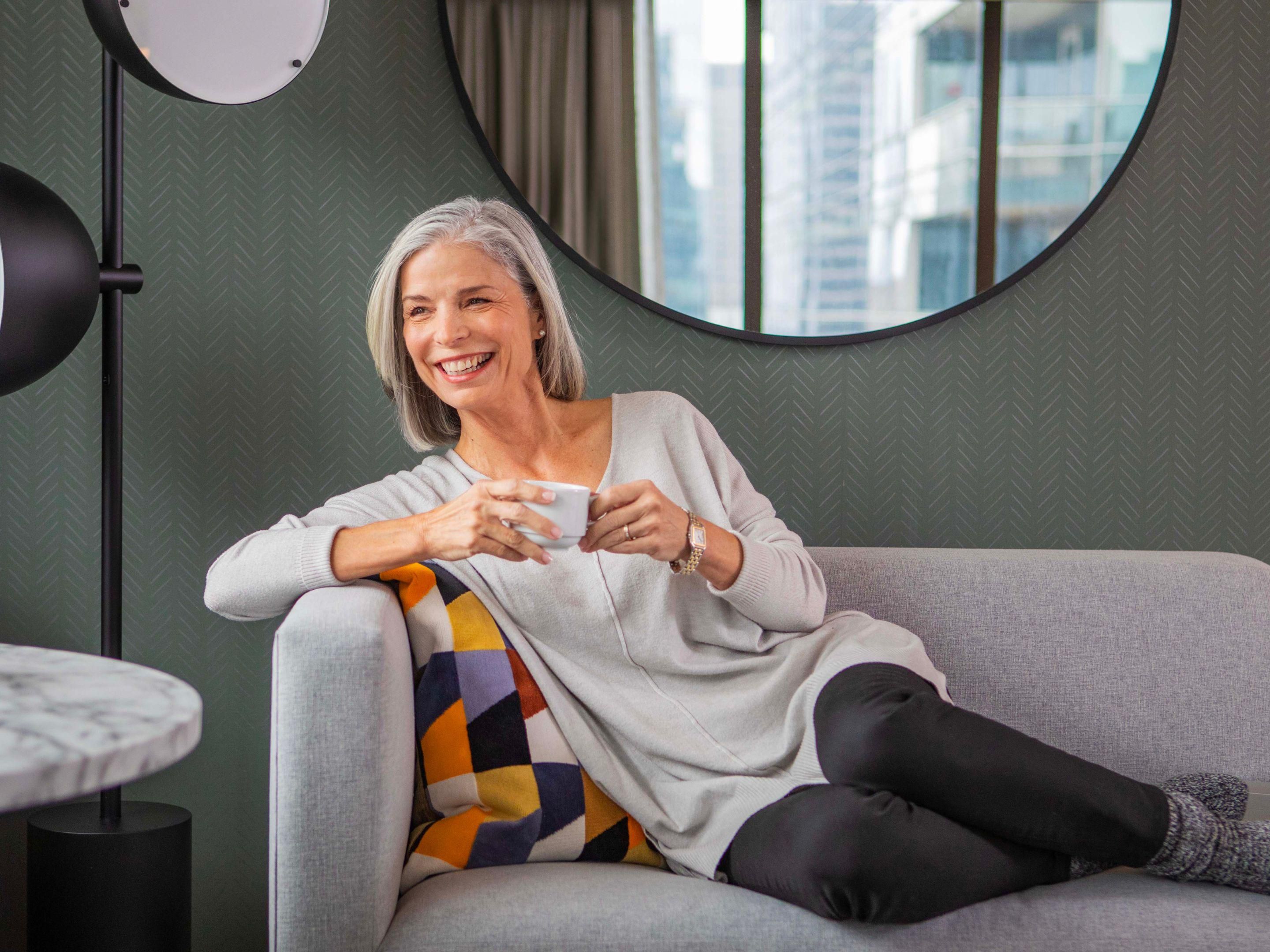 Woman smiling on a chaise lounge