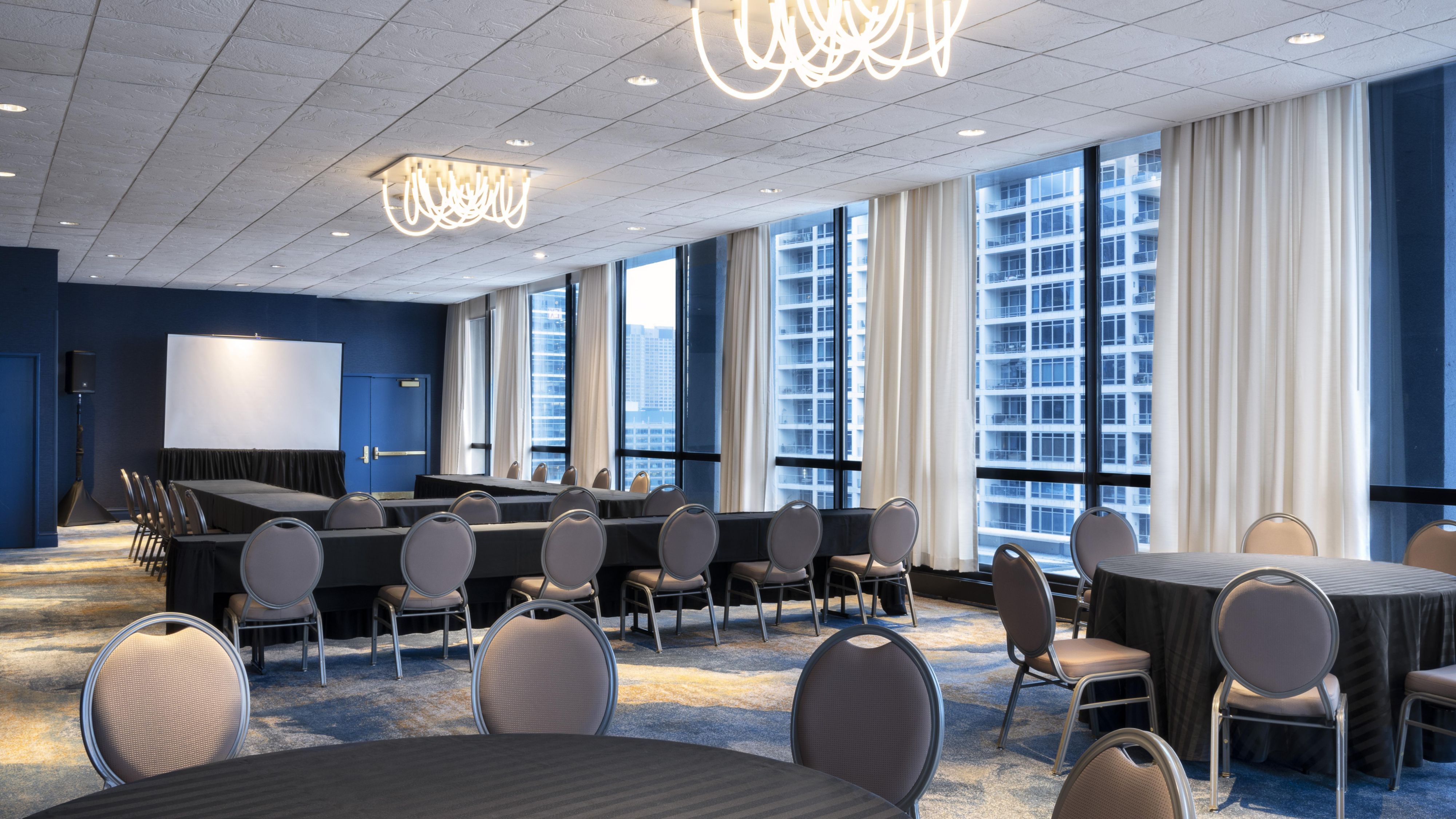 Large square table with conference phone in the center 