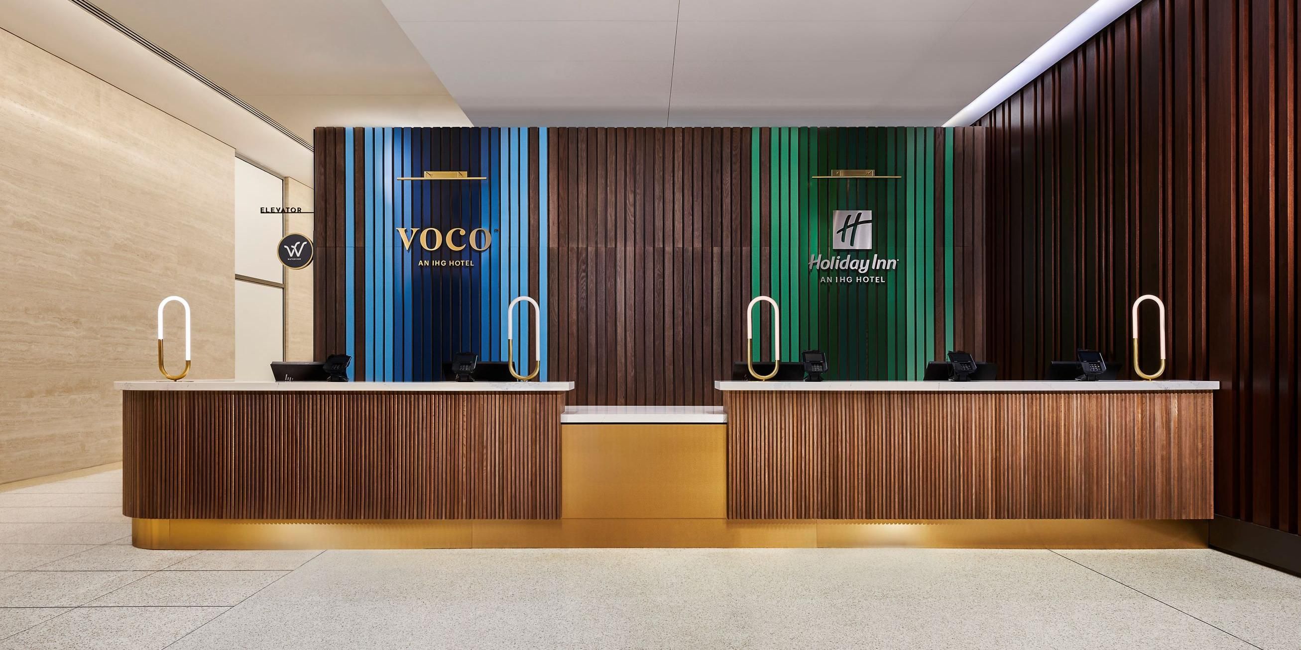 voco Chicago Downtown and Holiday Inn Wolf Point check-in desks are next to each other in a shared space