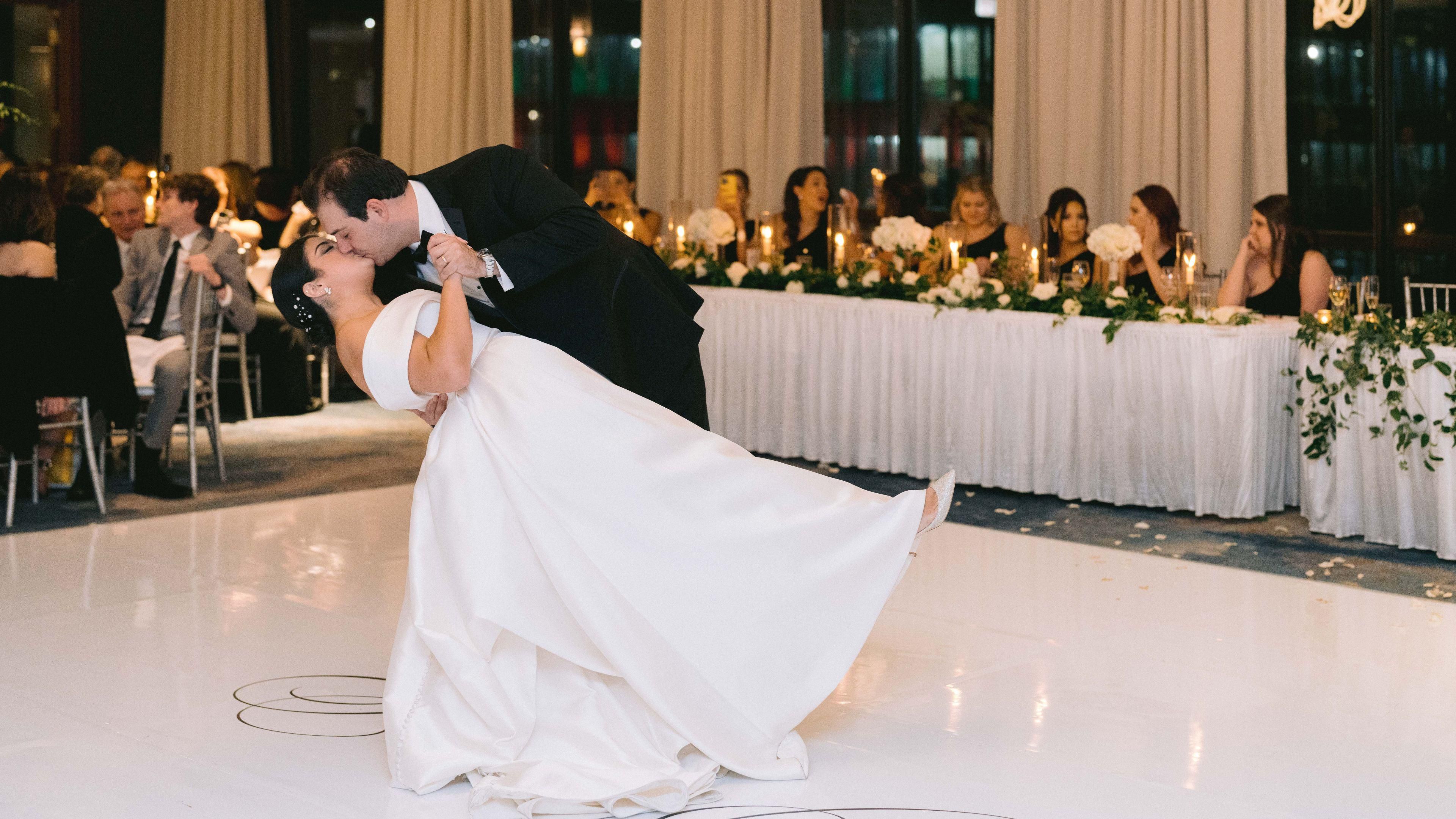 Groom dipping the bride on the dancefloor