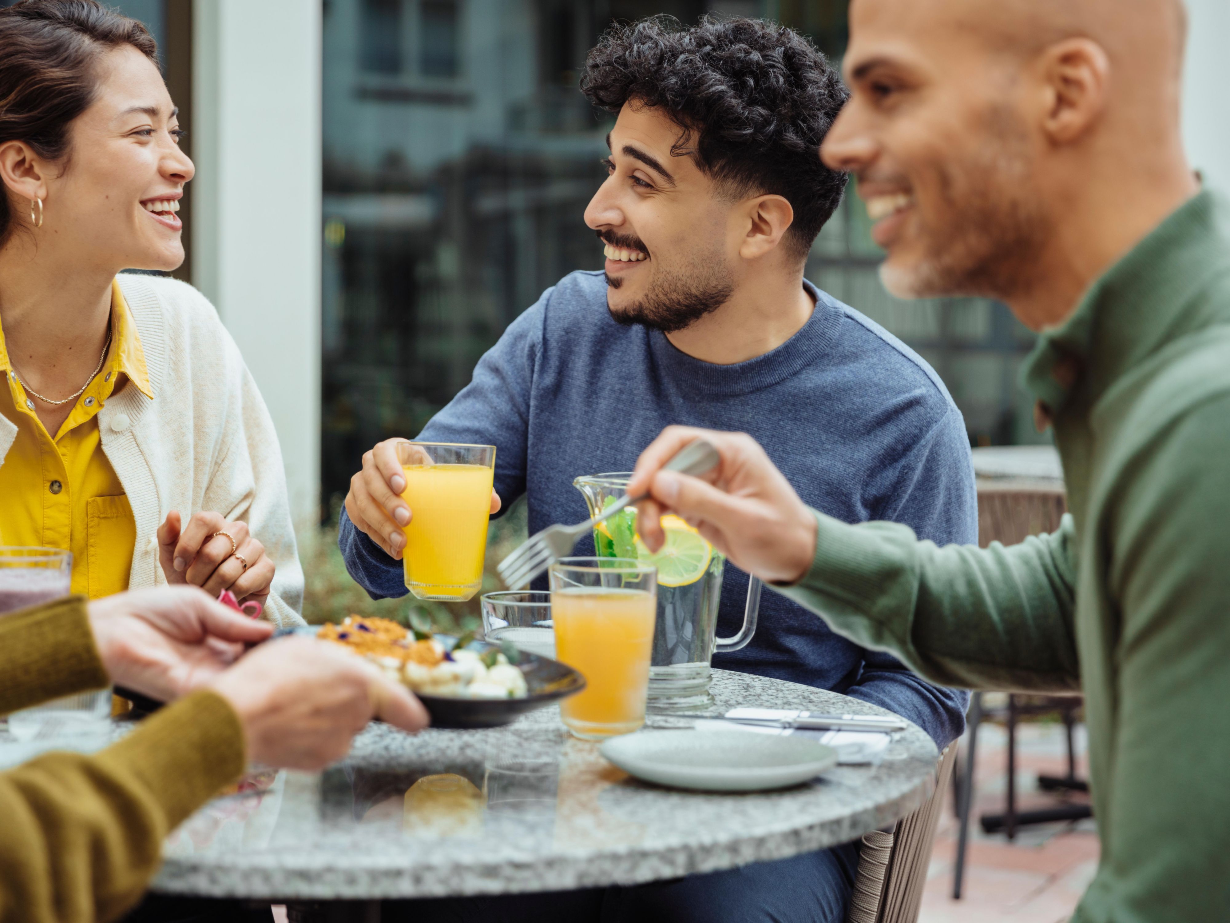 Friends talking over food