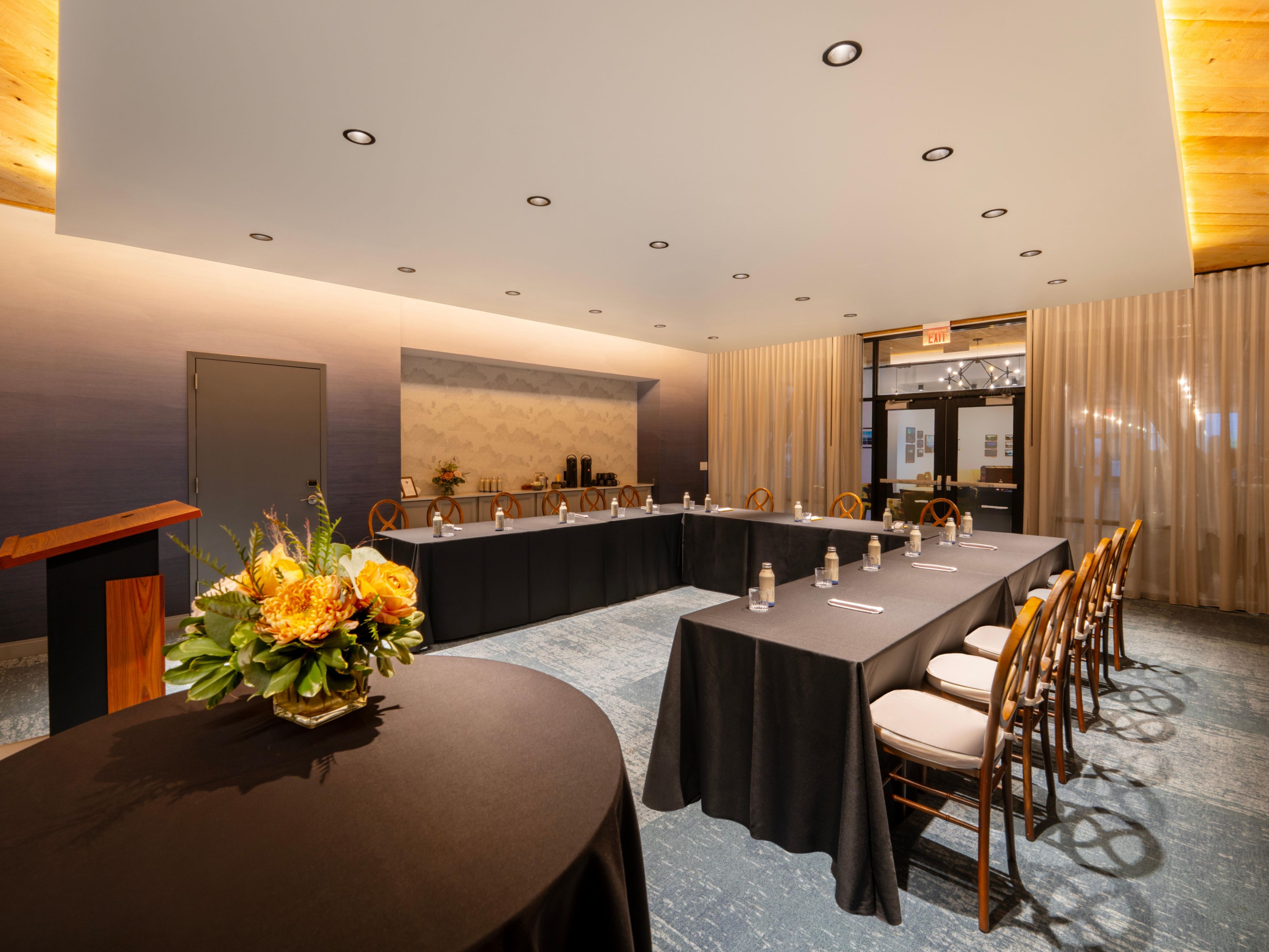 Conference room with u-shaped table and chairs