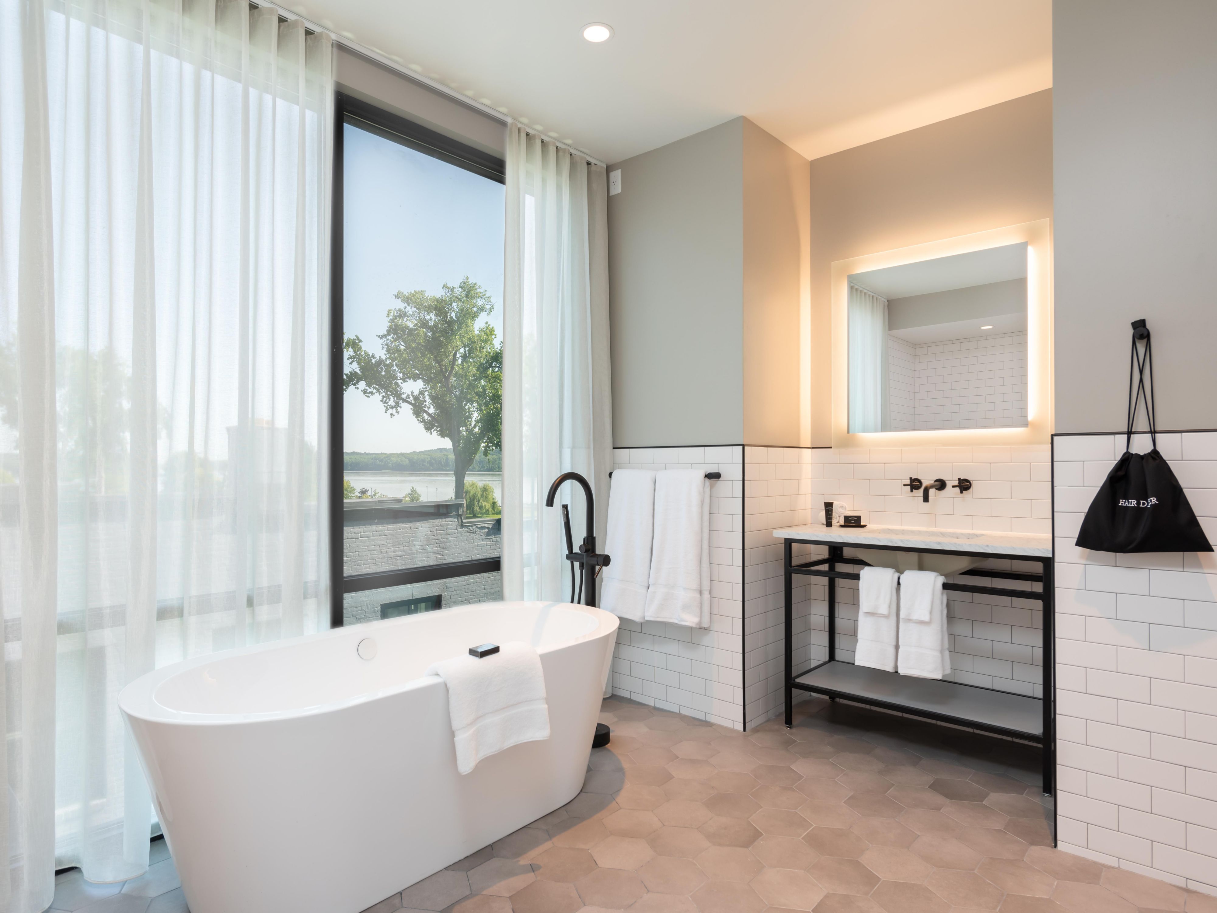 Indulge in select premium rooms featuring soaking tubs, offering a spa-like retreat after a day of Hudson Valley adventures. Enjoy personalized comfort and relaxation steps from local attractions in Coxsackie.