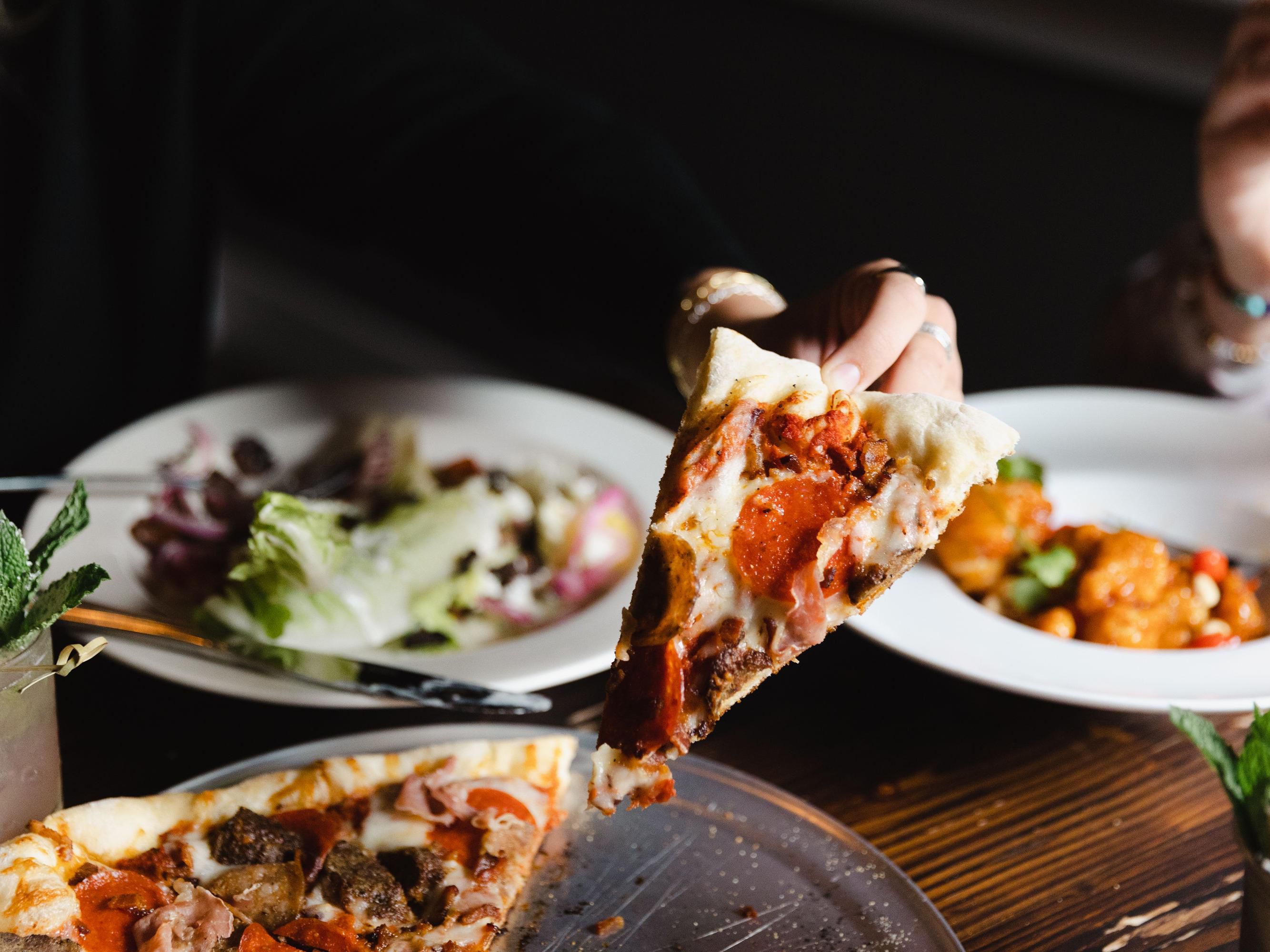 Enjoying the dining experience  with pizza