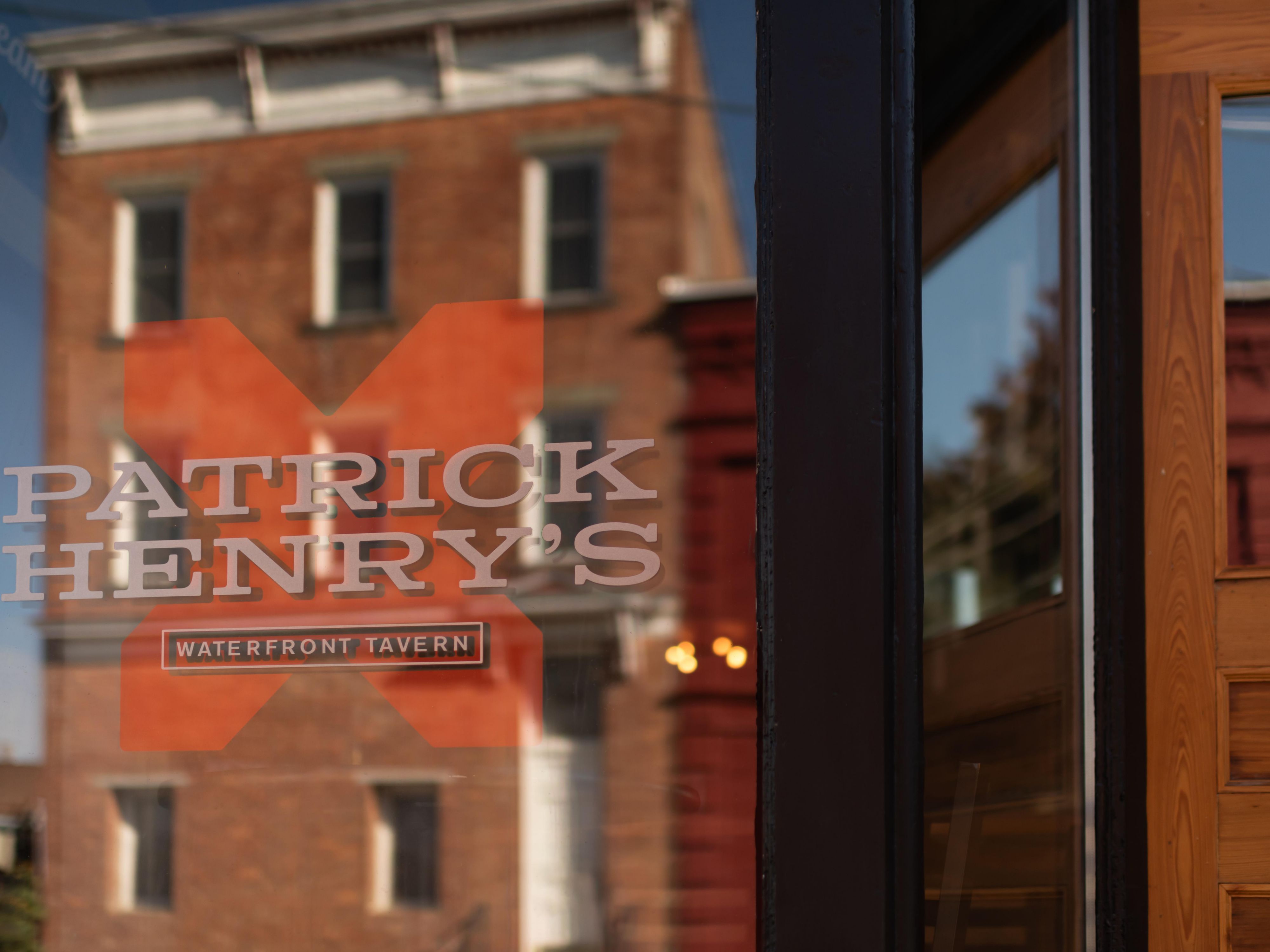 Restaurant sign reading Patrick Henry's Waterfront Tavern