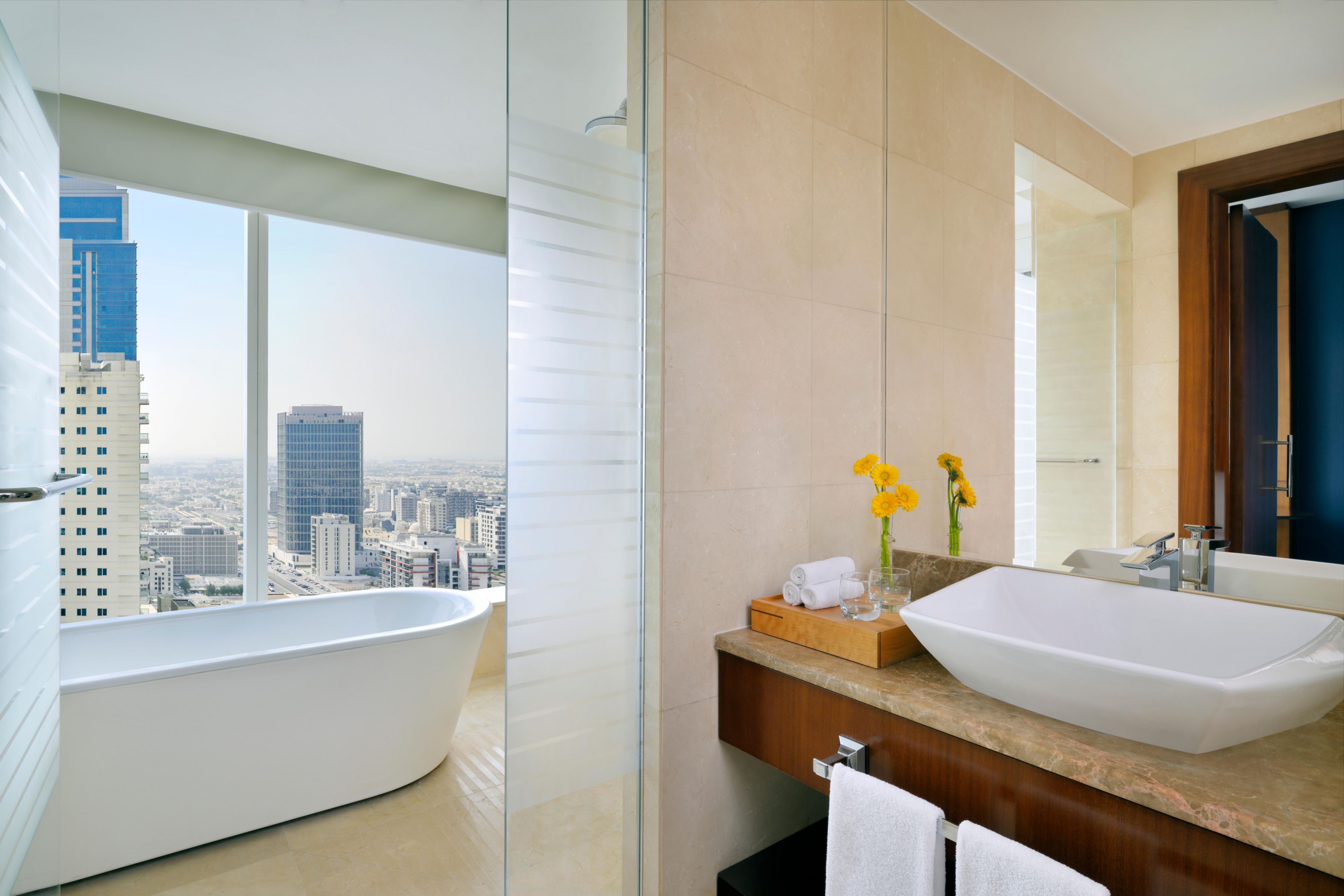 Enjoy a modern bathroom with natural light and a view