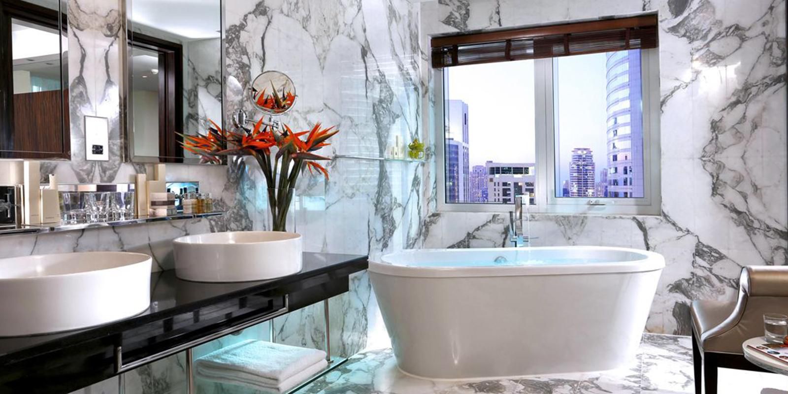Deluxe Suite Bathroom with stand-alone bath tub 