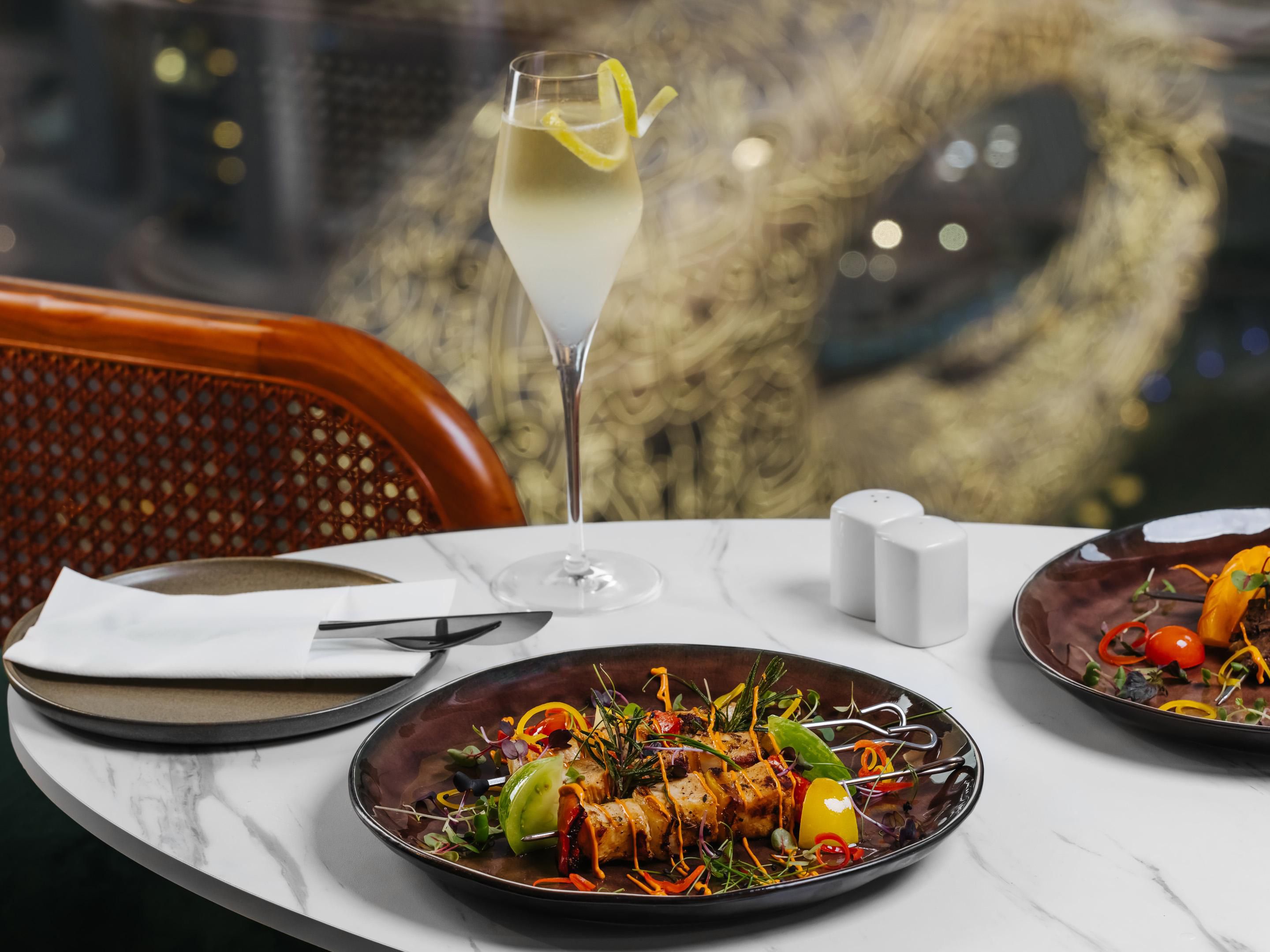 Perched on the 49th floor of the hotel, Windows Bar & Lounge features floor-to-ceiling glass windows offering uninterrupted views over the breathtaking city of Dubai. Its contemporary and sophisticated design, along with great cocktails, bubbly, and bites, creates a chilled and friendly social spot to enjoy your night.
