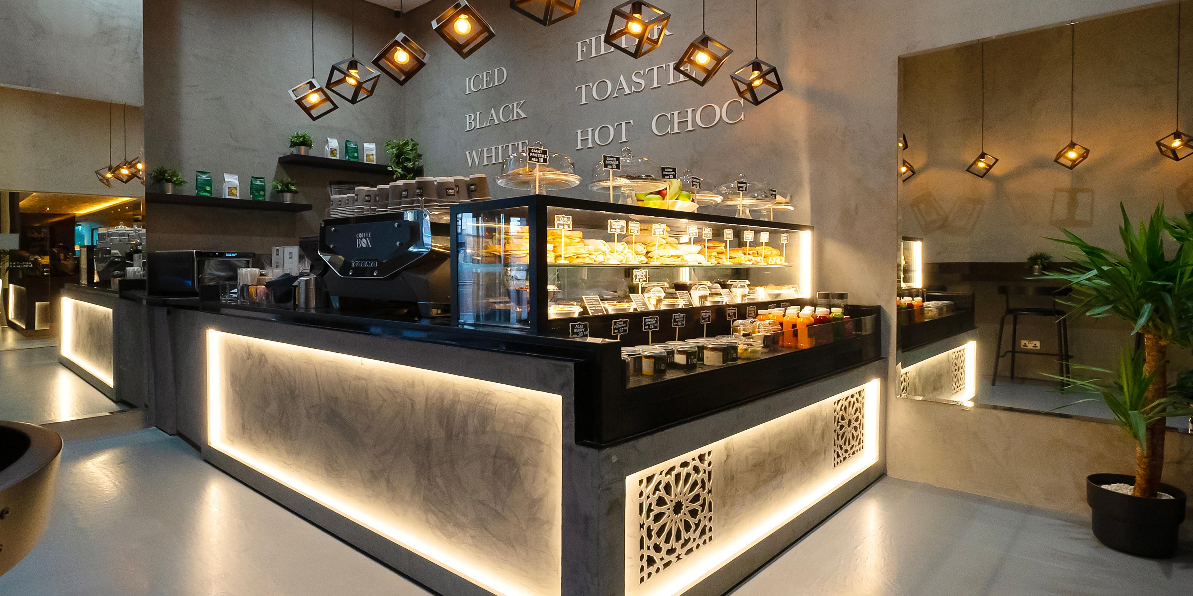 Located conveniently in the lobby offering a delightful array of beverages and bites to energize your day. Indulge in premium coffee, alongside a selection of healthy juices and a variety of sandwiches and snacks designed for convenience without compromising on quality.