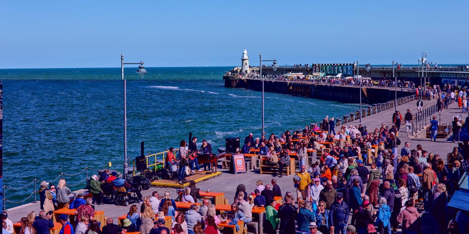 Folkestone’s restored Harbour Arm is a beautiful promenade out at sea with a World-class view. Formerly a ferry port, Folkestone Harbour Arm is now home to a growing collection of independent businesses that has become a centre for Food, Drink and Entertainment in Kent; the Garden of England.