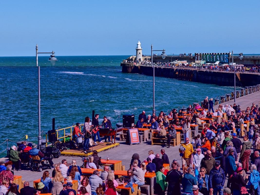 Folkestone’s restored Harbour Arm is a beautiful promenade out at sea with a World-class view. Formerly a ferry port, Folkestone Harbour Arm is now home to a growing collection of independent businesses that has become a centre for Food, Drink and Entertainment in Kent; the Garden of England.