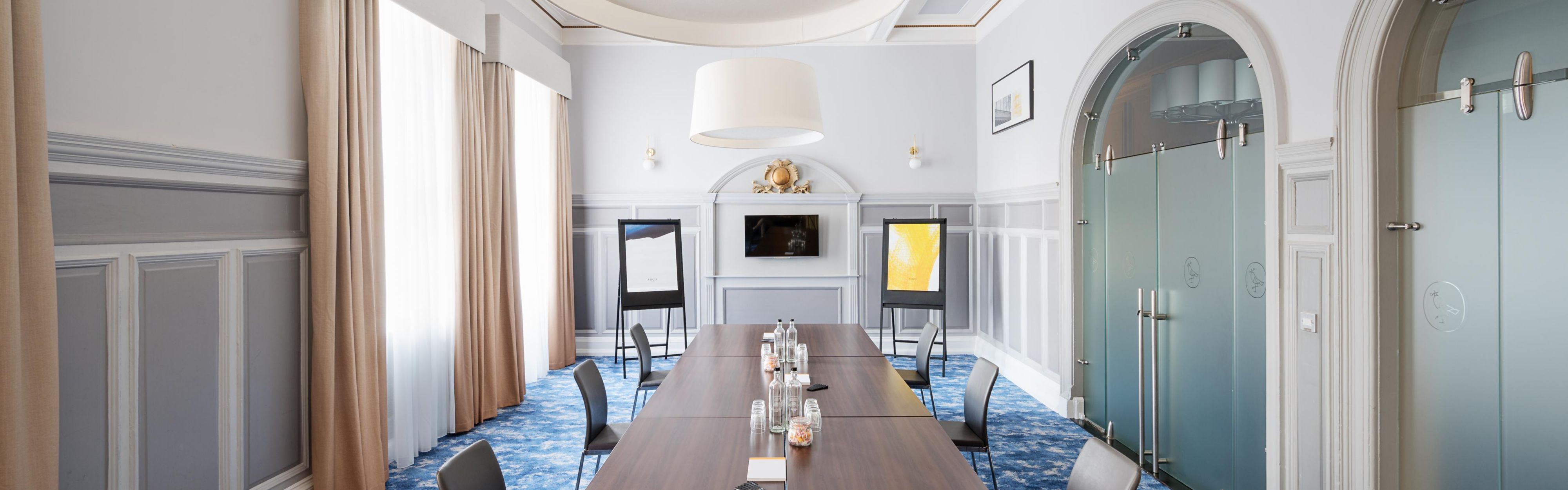 Meeting room with a long table and natural lighting