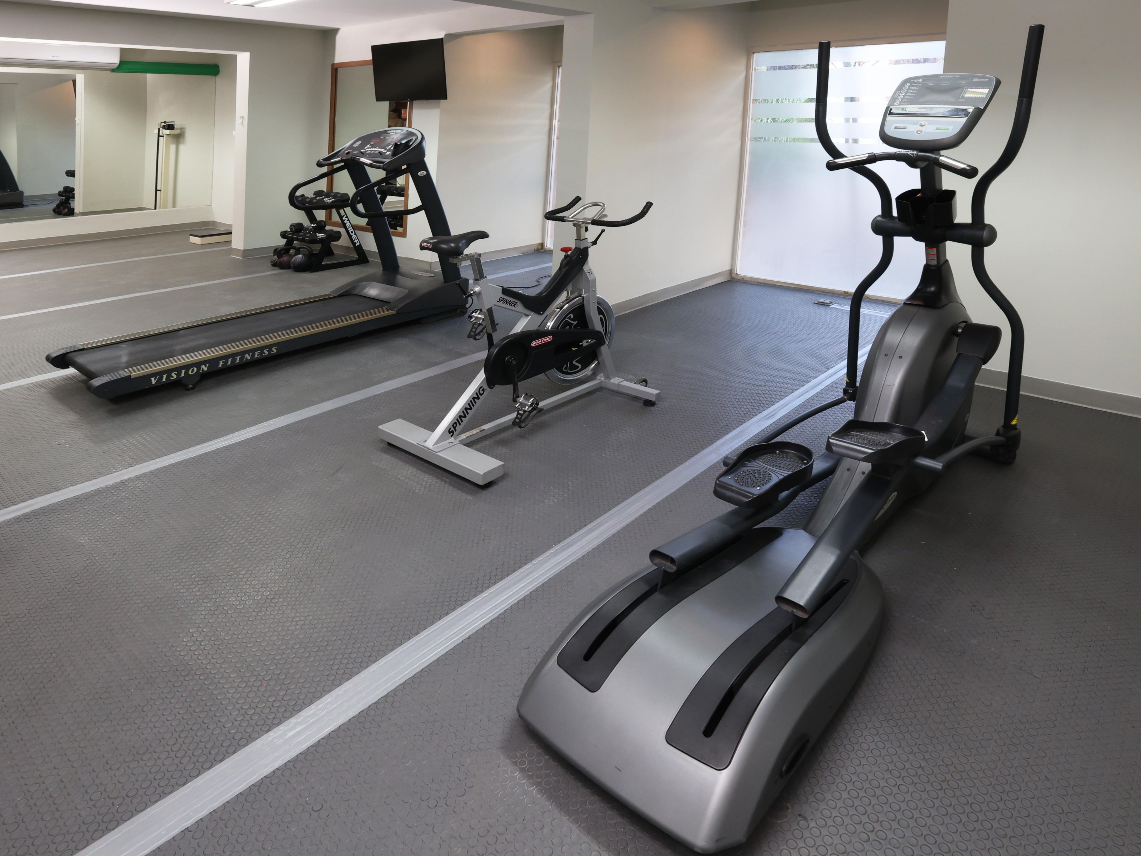 Gym available with cardio and weight equipment.