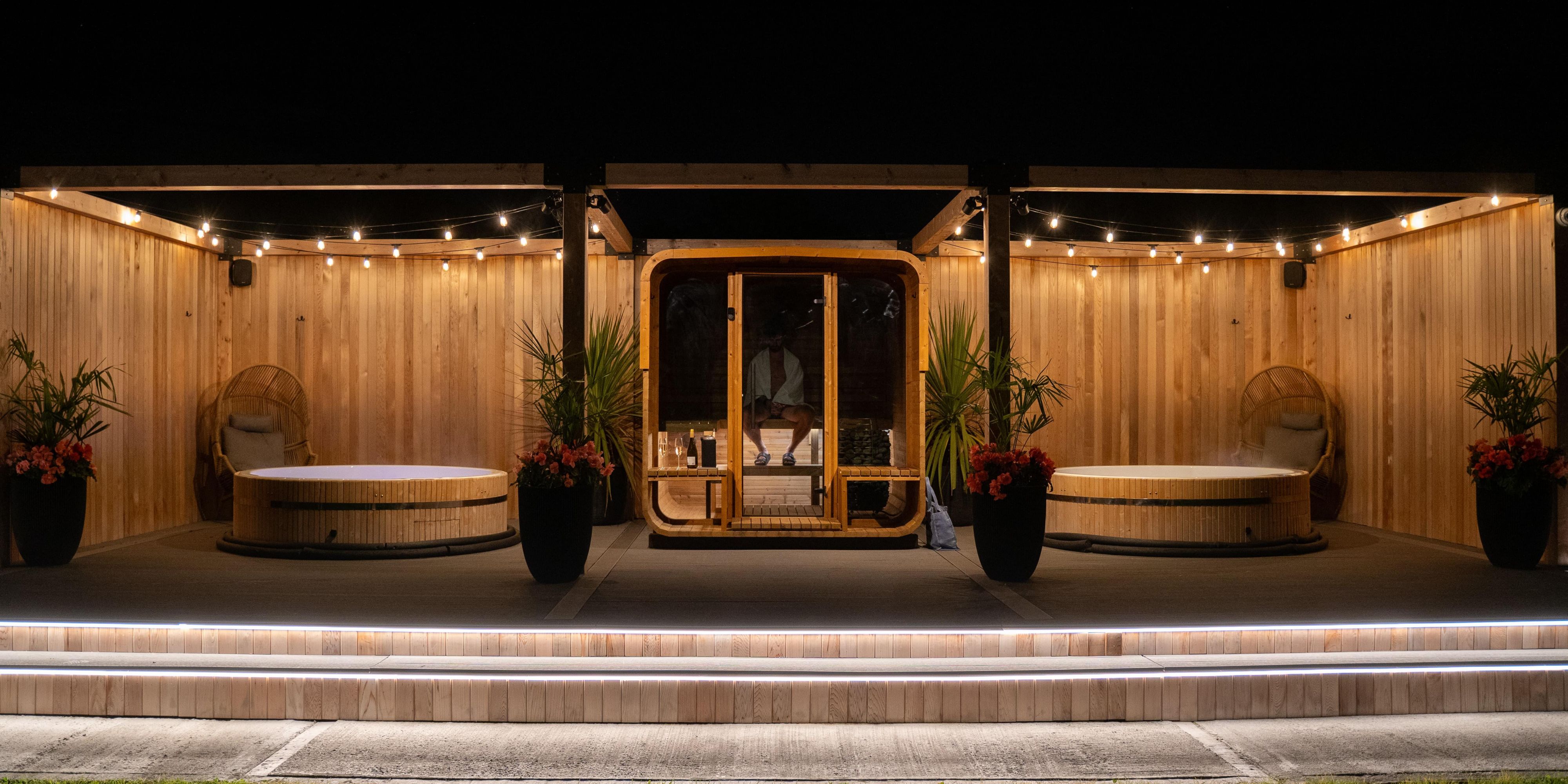 Discover our outdoor spa The Deck. Relax and recharge with full access to The Deck — featuring a hot tub, sauna, and complimentary refreshments — exclusively for our guests. Staying over the weekend? Elevate your experience with indulgent in-room spa treatments for the ultimate relaxation. 