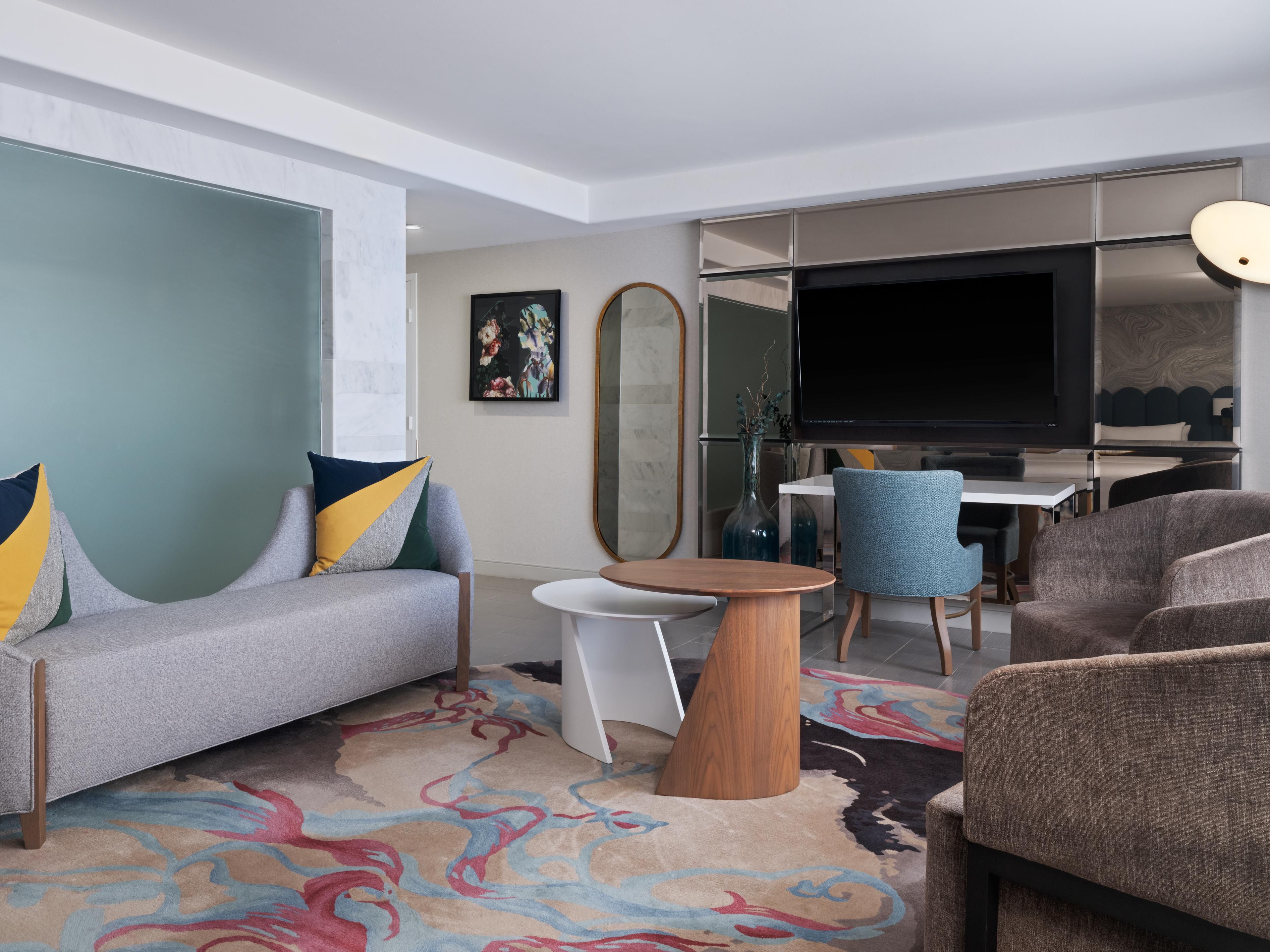 Separate suite living area with comfortable seating and workspace.
