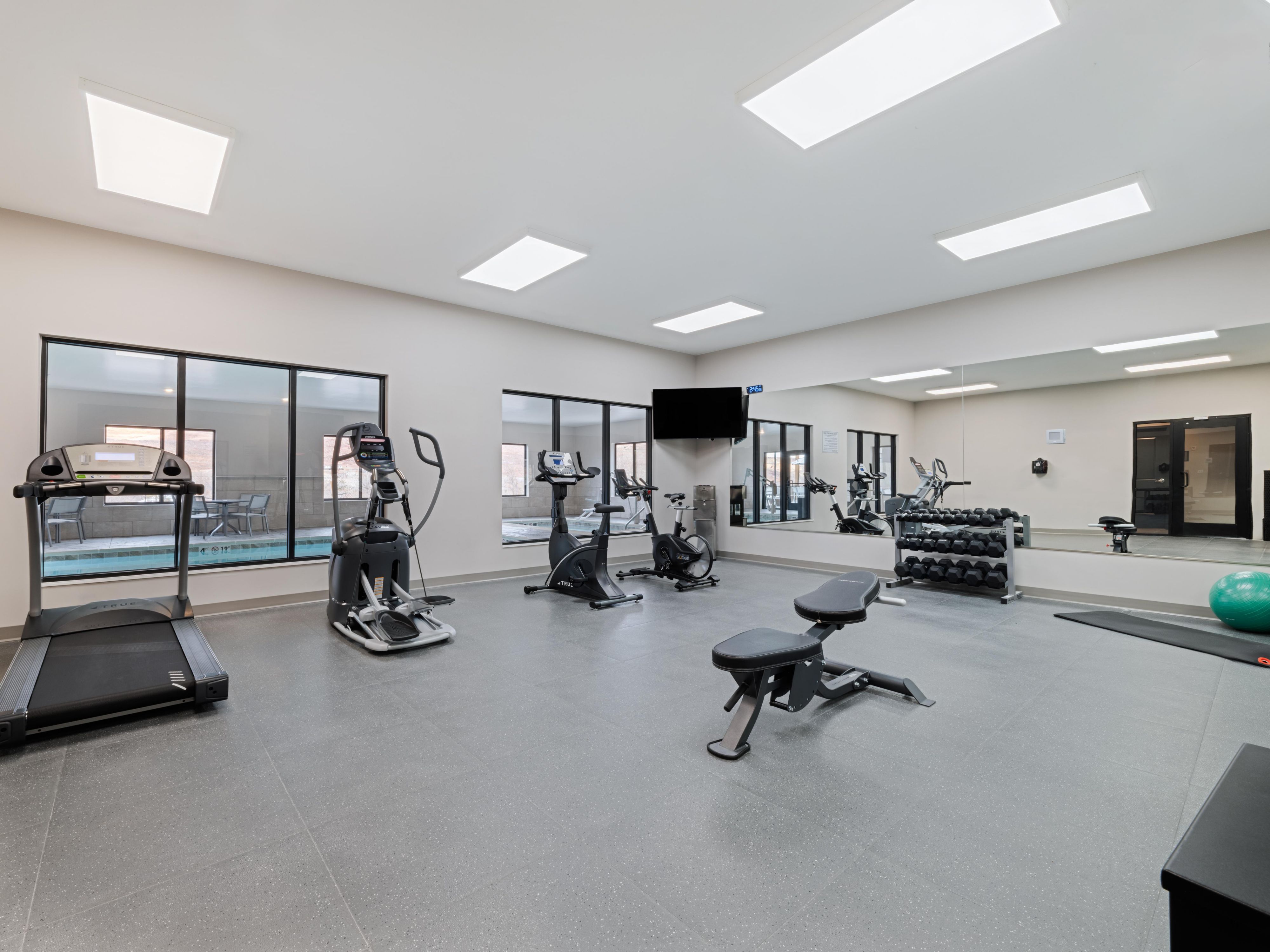 Well-equipped gym at voco Moab, next to the indoor pool