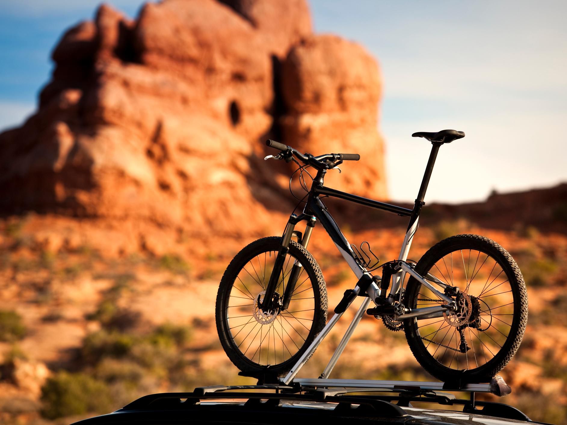 Mountain bike on car traveling in Moab