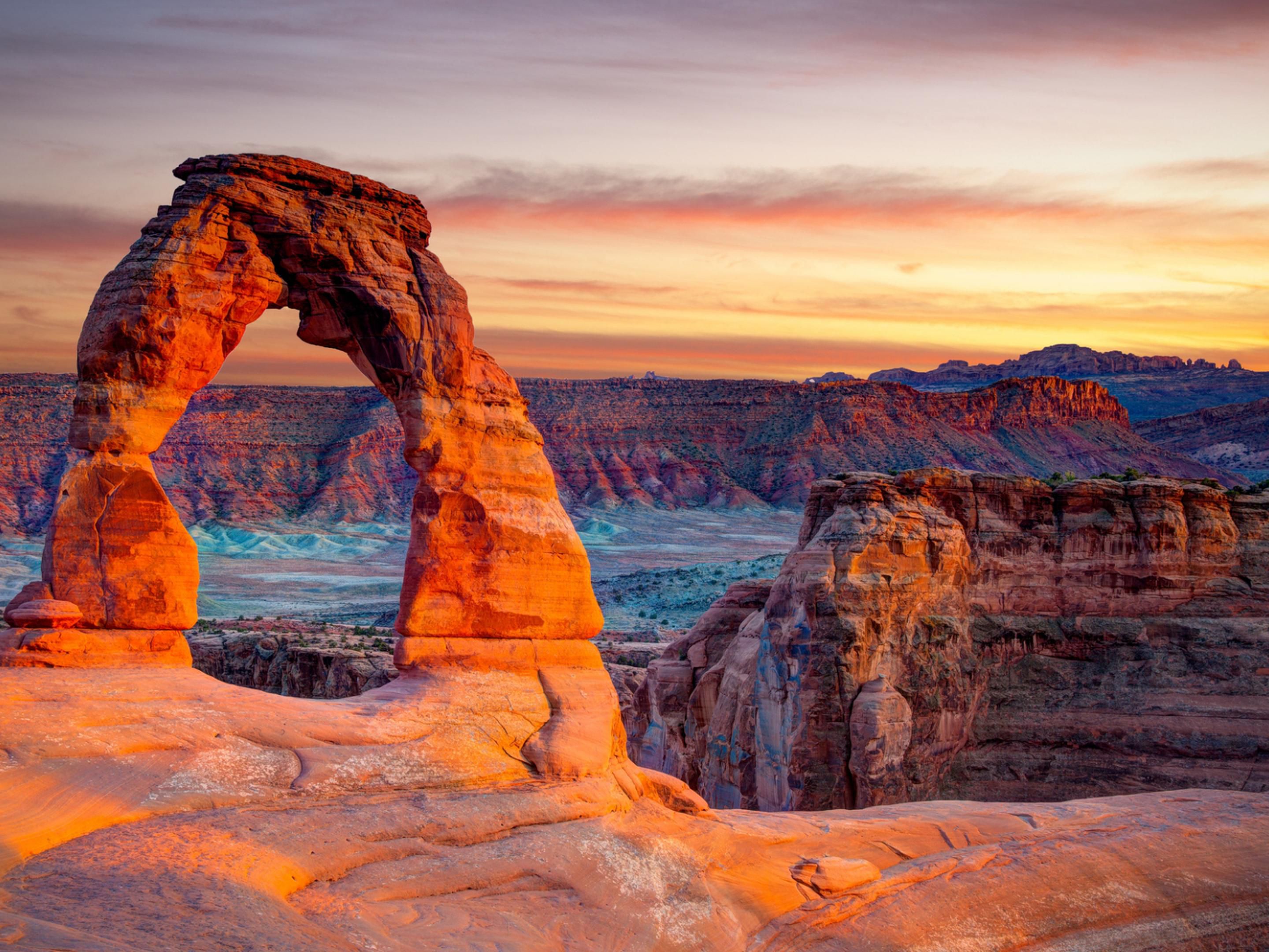 Sunrise at Delicate Arch in Arches National Park.