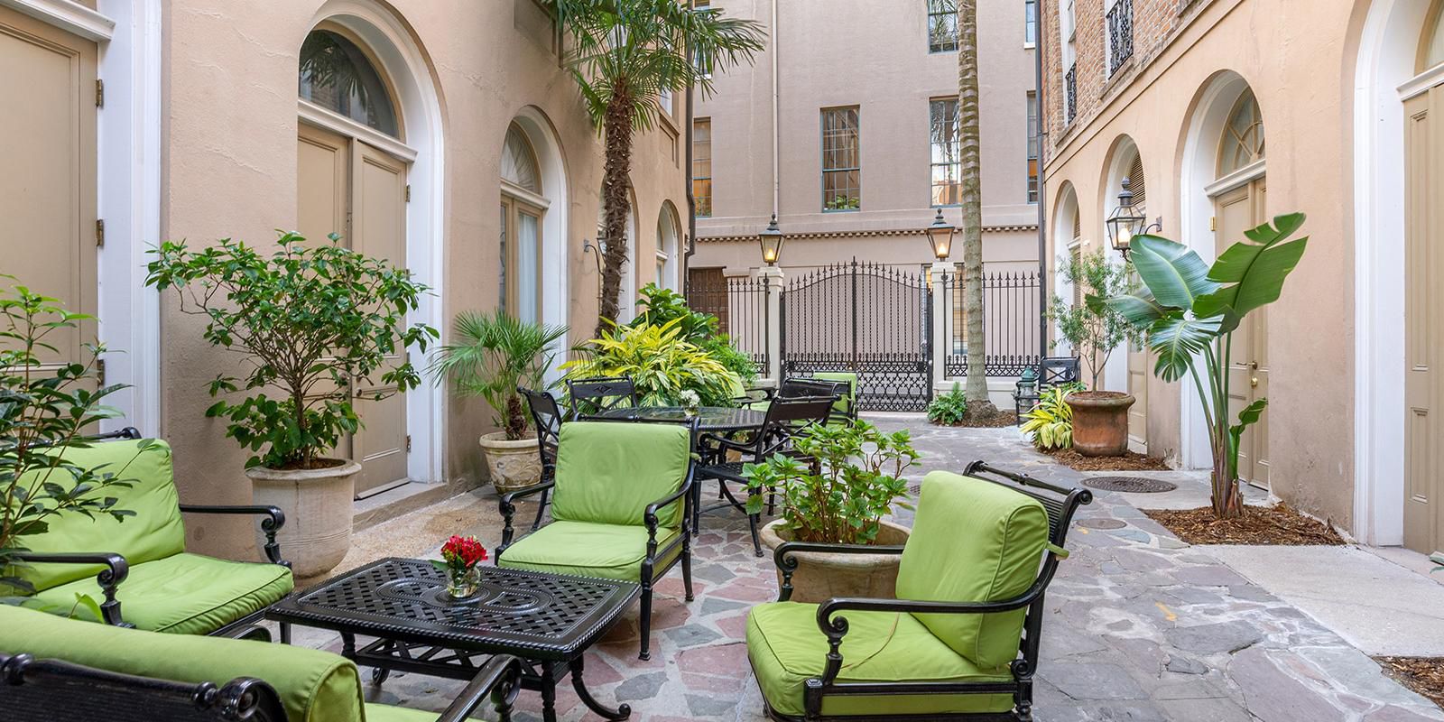 Retreat to our charming courtyard oasis, a tranquil escape from the lively streets of New Orleans. Gather with friends and family in one of our many inviting seating areas and enjoy a peaceful moment in the heart of the city. 