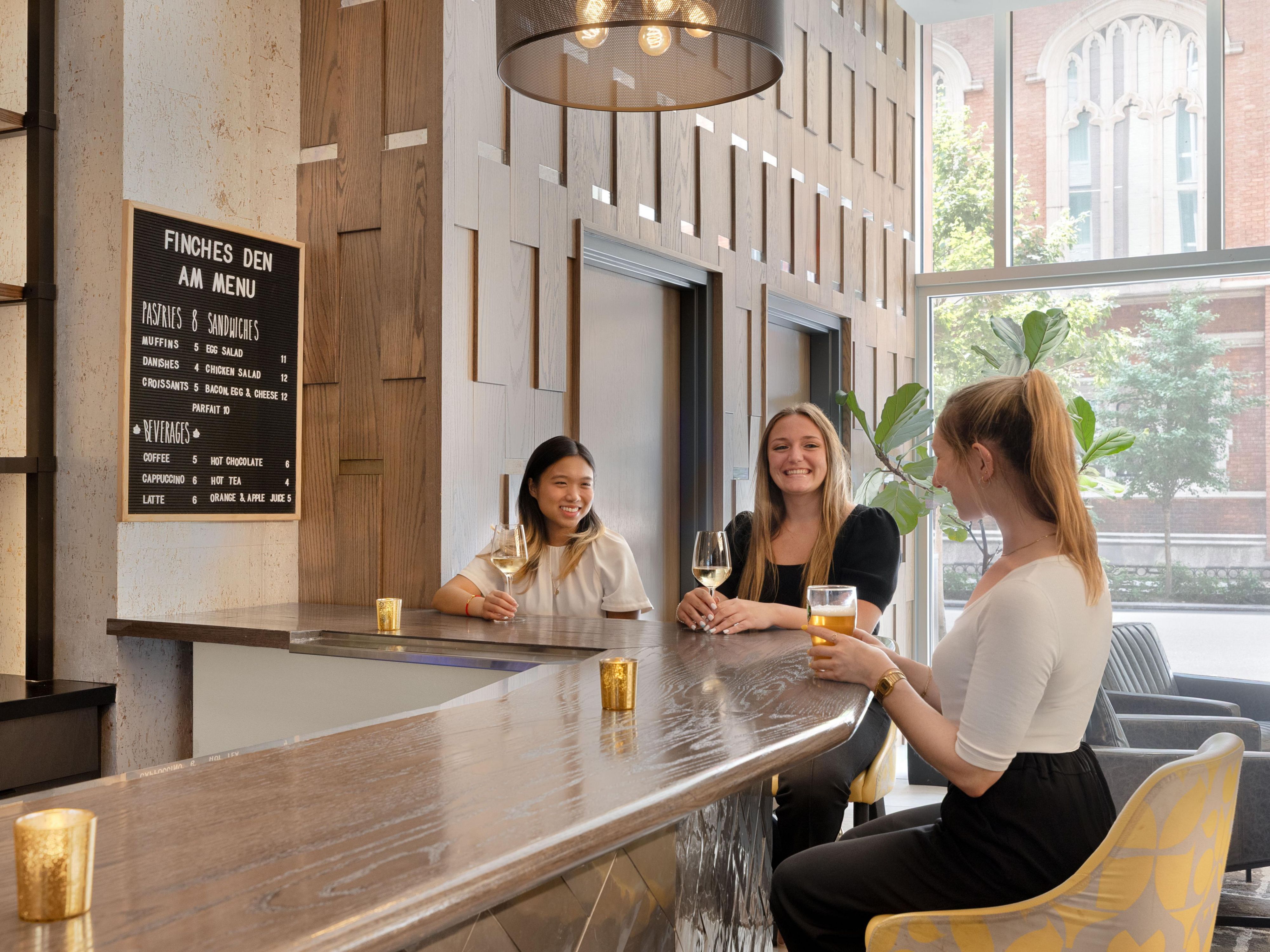 Friends sharing a drink at the bar