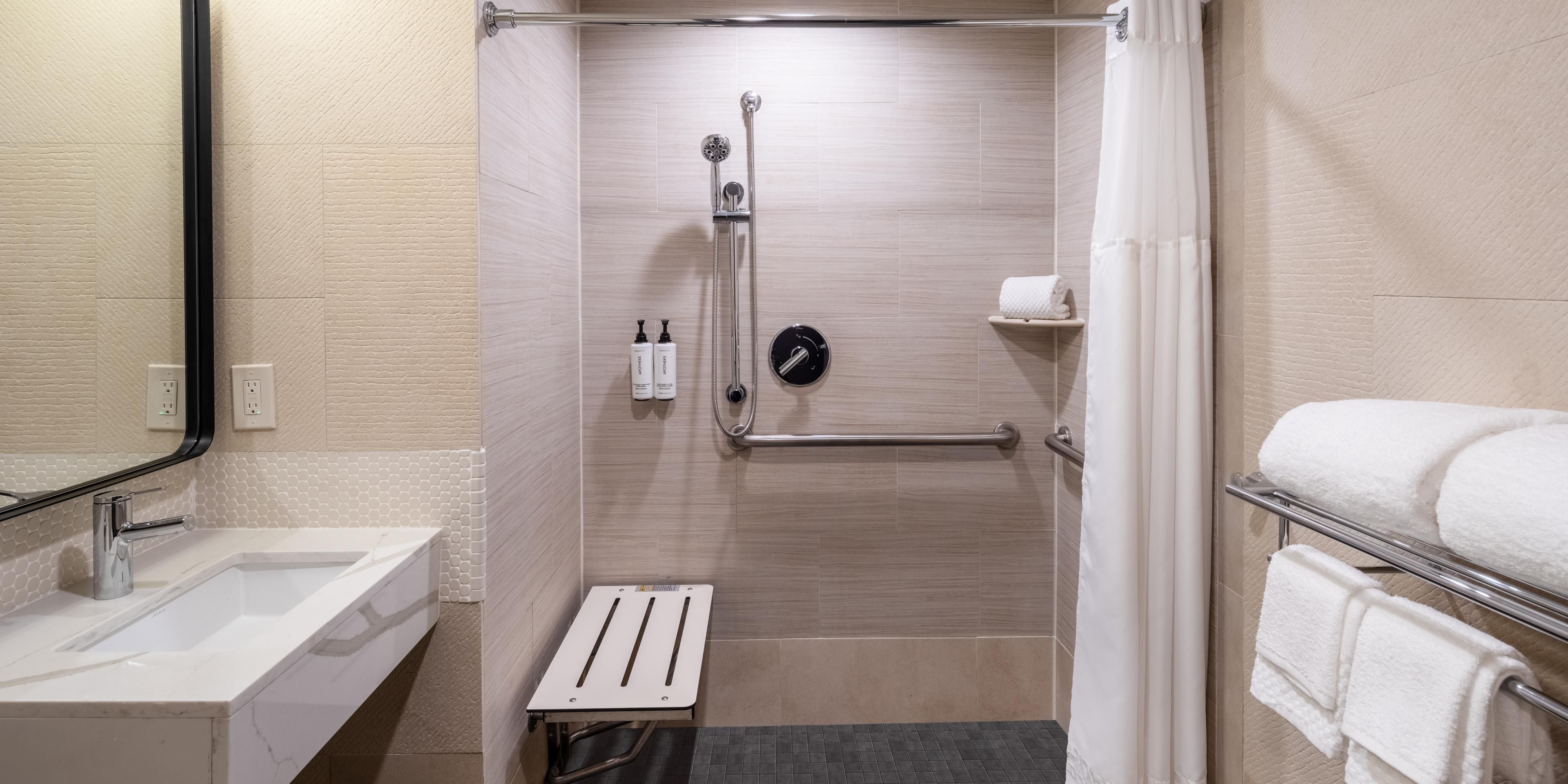 Mobility accessible rooms feature roll-in shower.