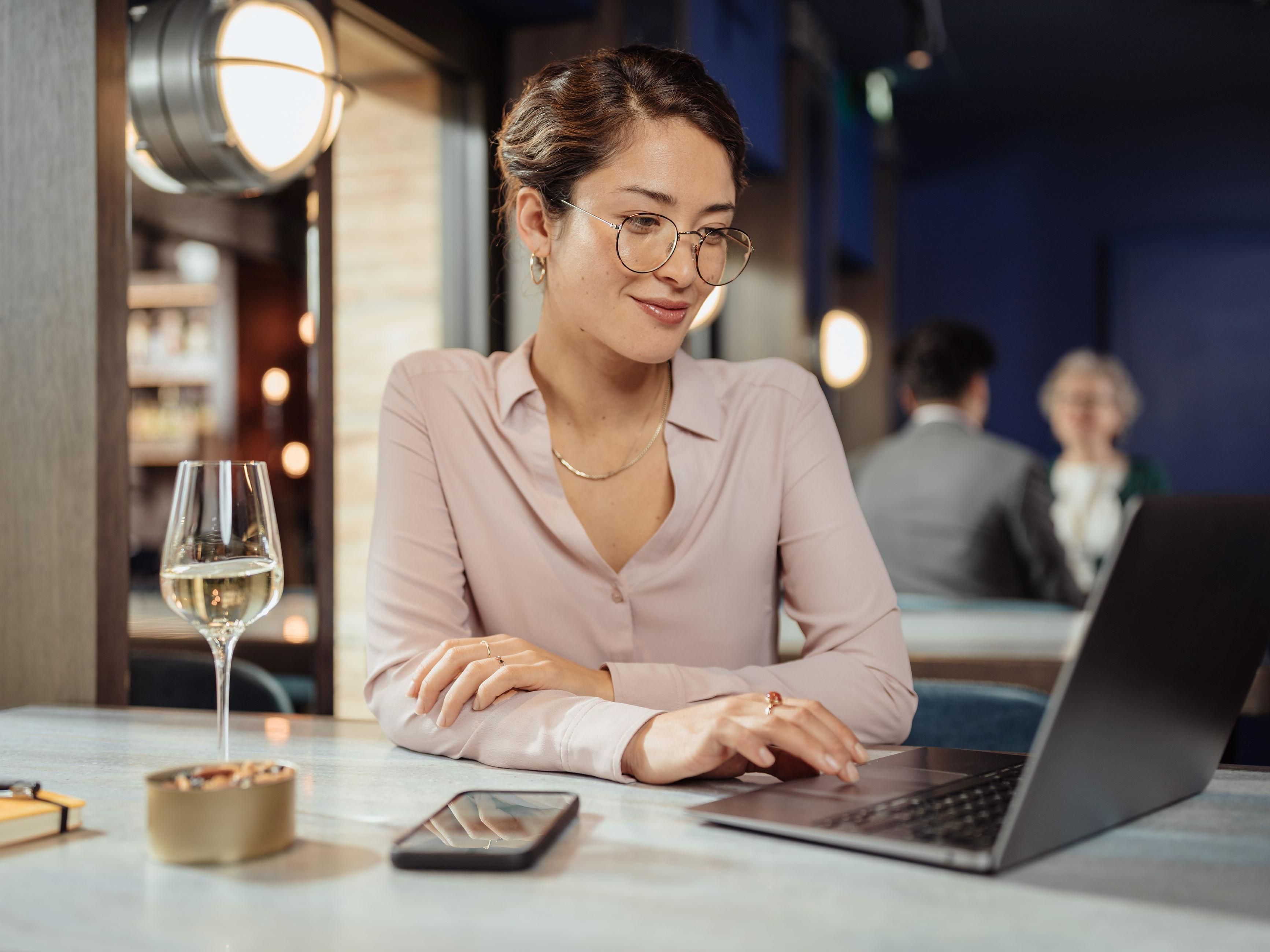 Business woman having a glass of wine