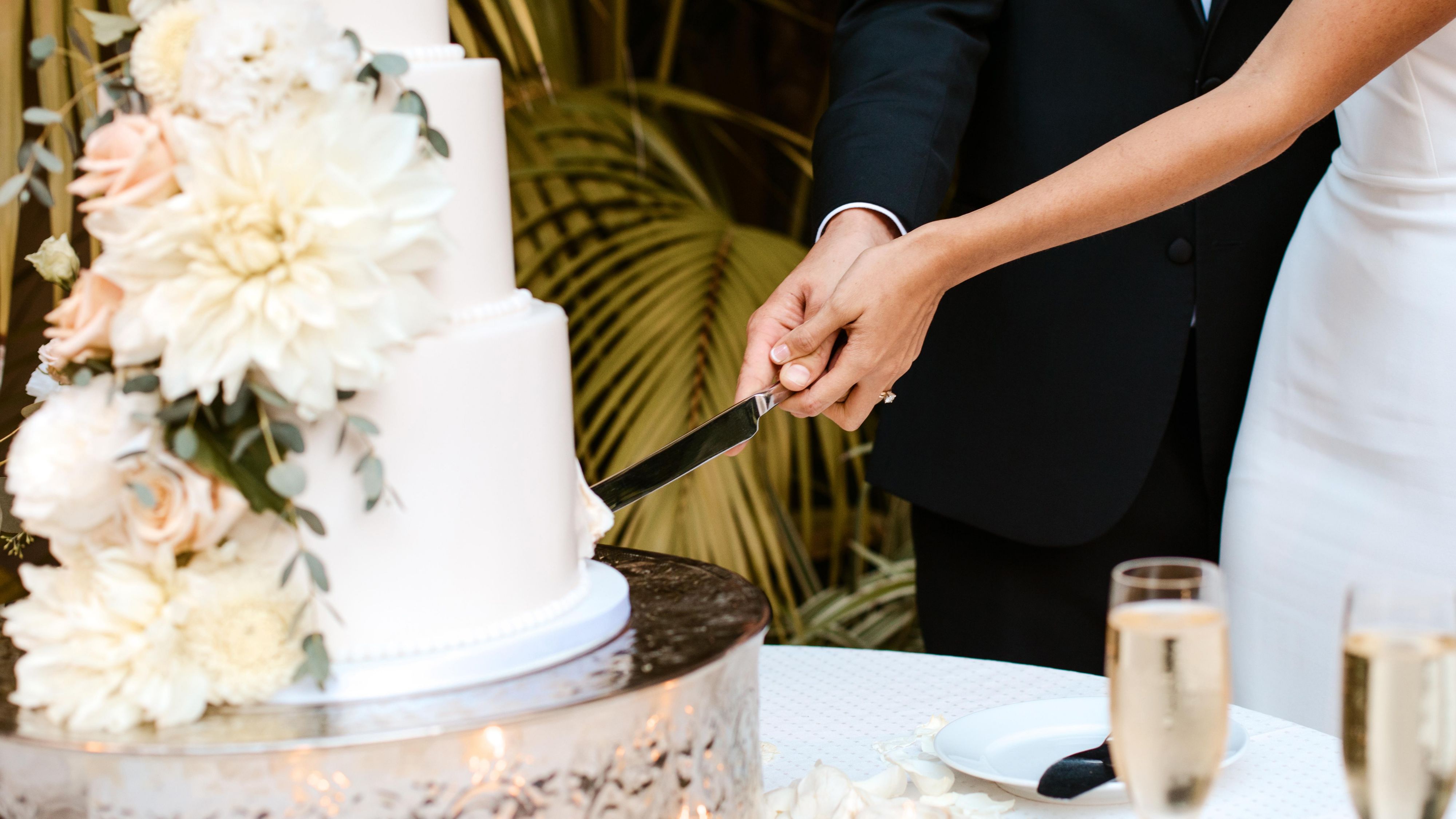 Couple cutting their wedding cake