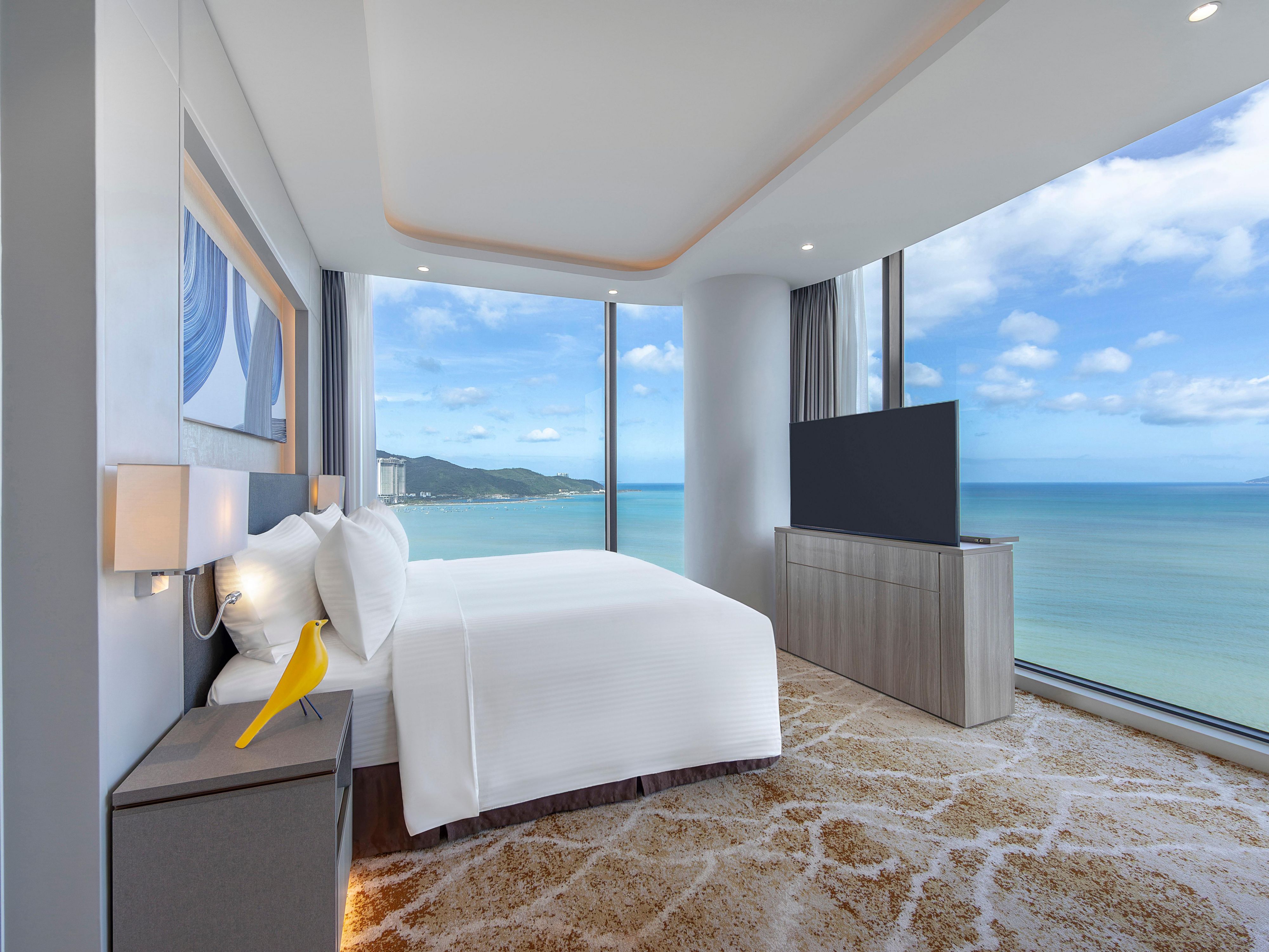 Relax in 250 modern rooms and suites where the ocean becomes part of your stay. Every room features a private balcony, calming sea views, and a generous bathtub, paired with premium bedding, smart technology, and refined amenities — creating a light-filled, indulgent retreat designed for effortless comfort and relaxation