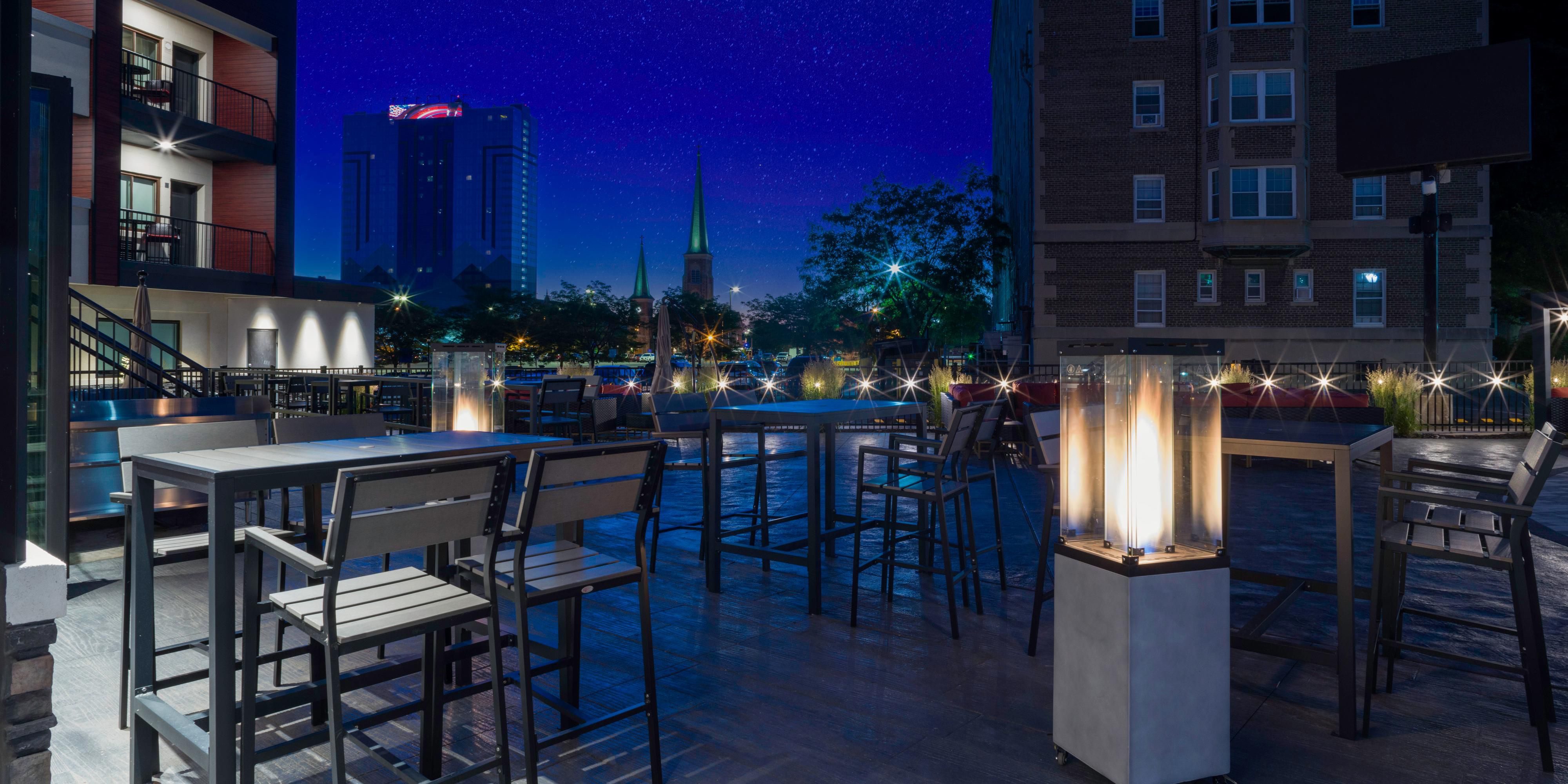 Gather with friends and enjoy some quality time in nature on our outdoor patio, featuring a beautiful space with a fireplace. Grab a drink, mingle, and get cozy under the stars. 