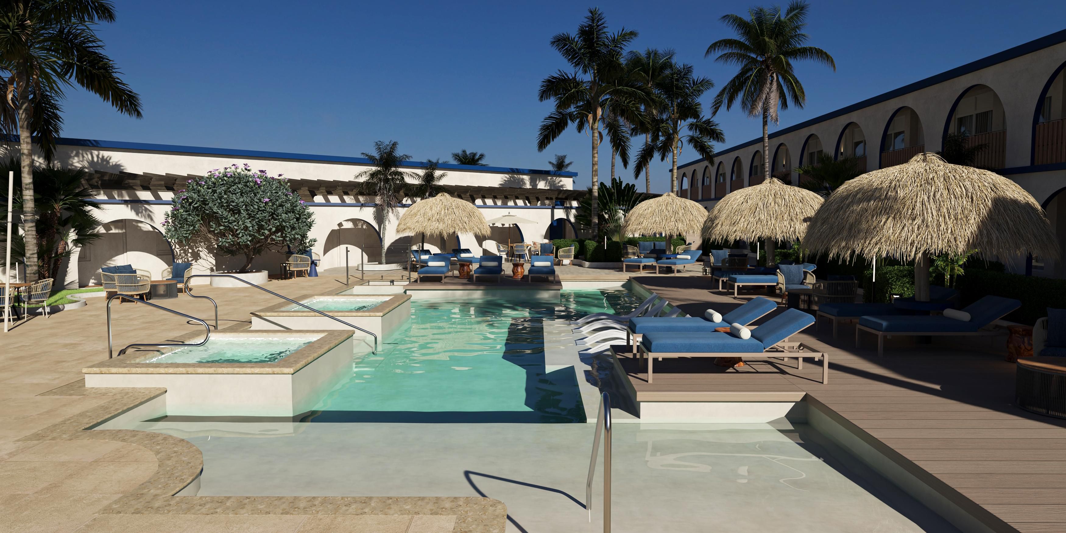 Take a refreshing dip in our inviting outdoor pool, the perfect hotel for relaxation during your stay. 