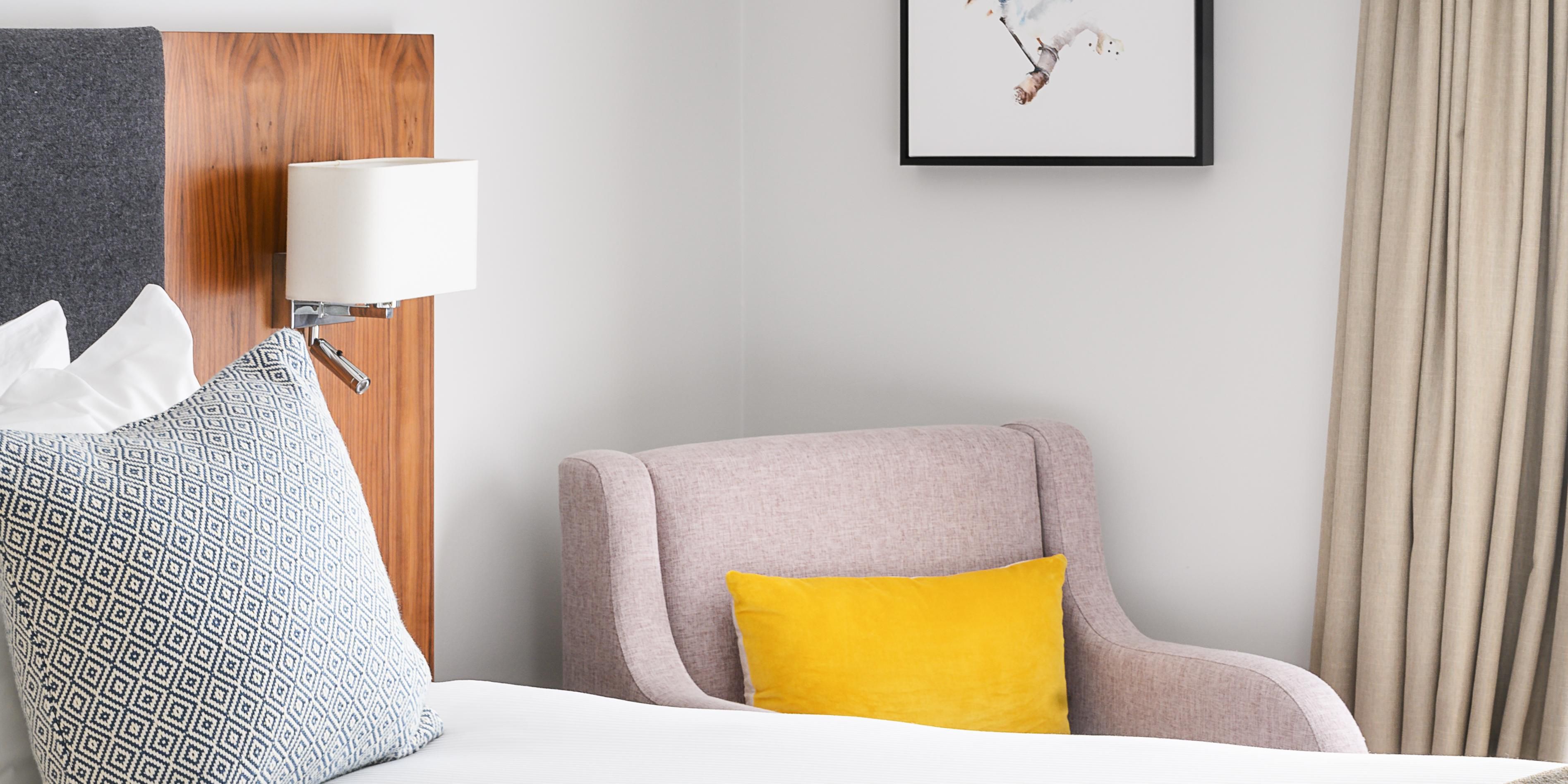 hotel guest room with premium bedding