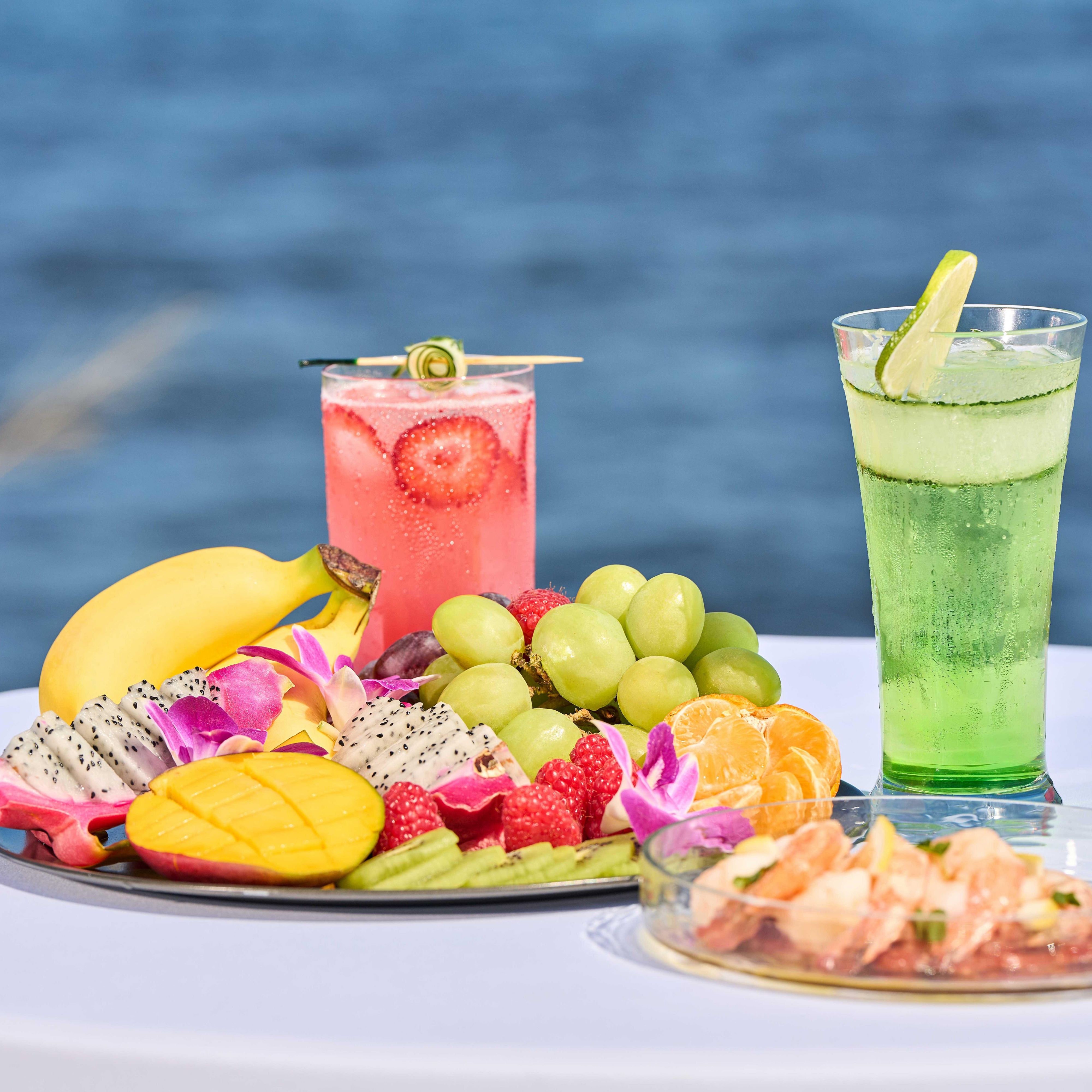 Fresh restaurant fruit plate and cocktails