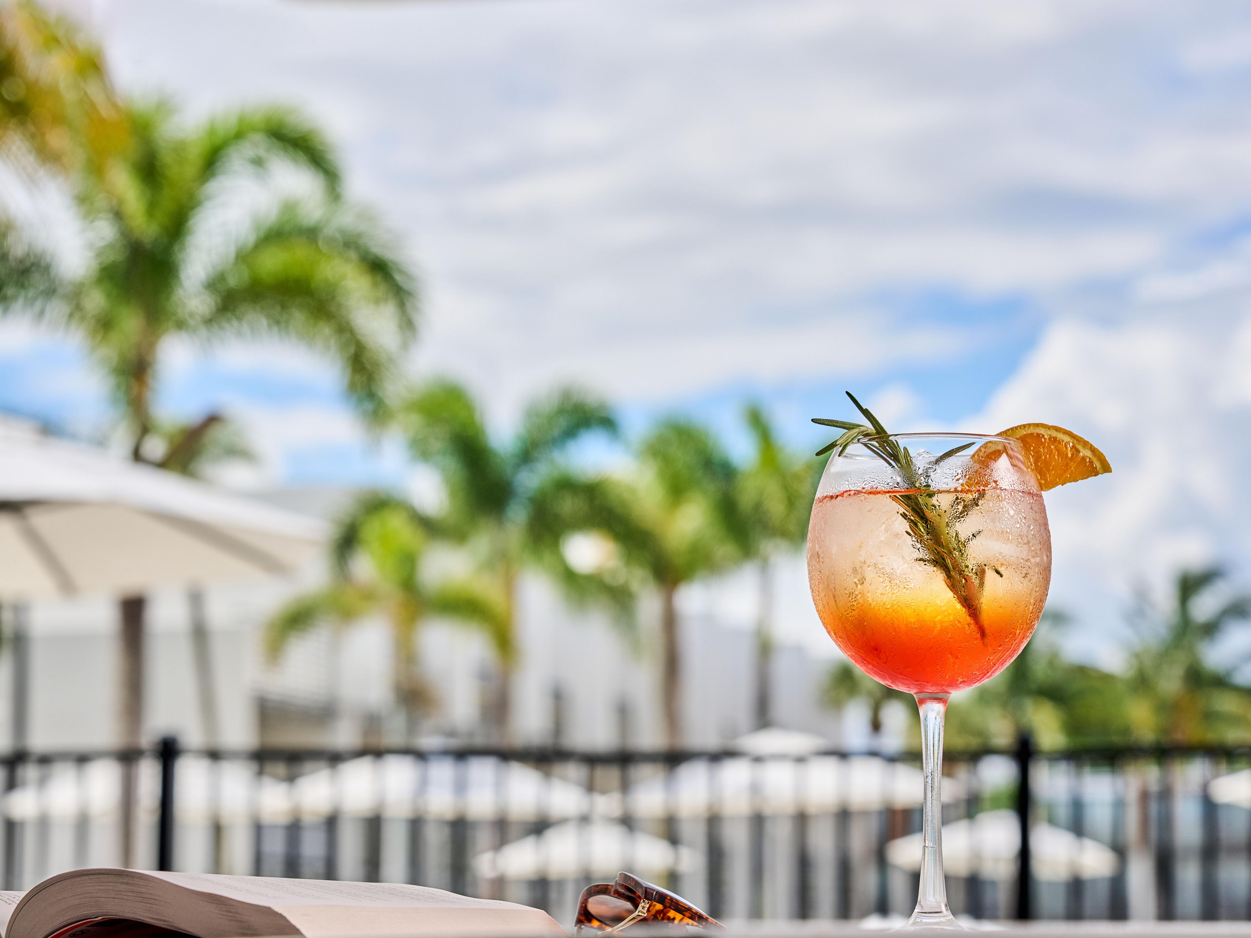 Enjoying a cocktail by the pool