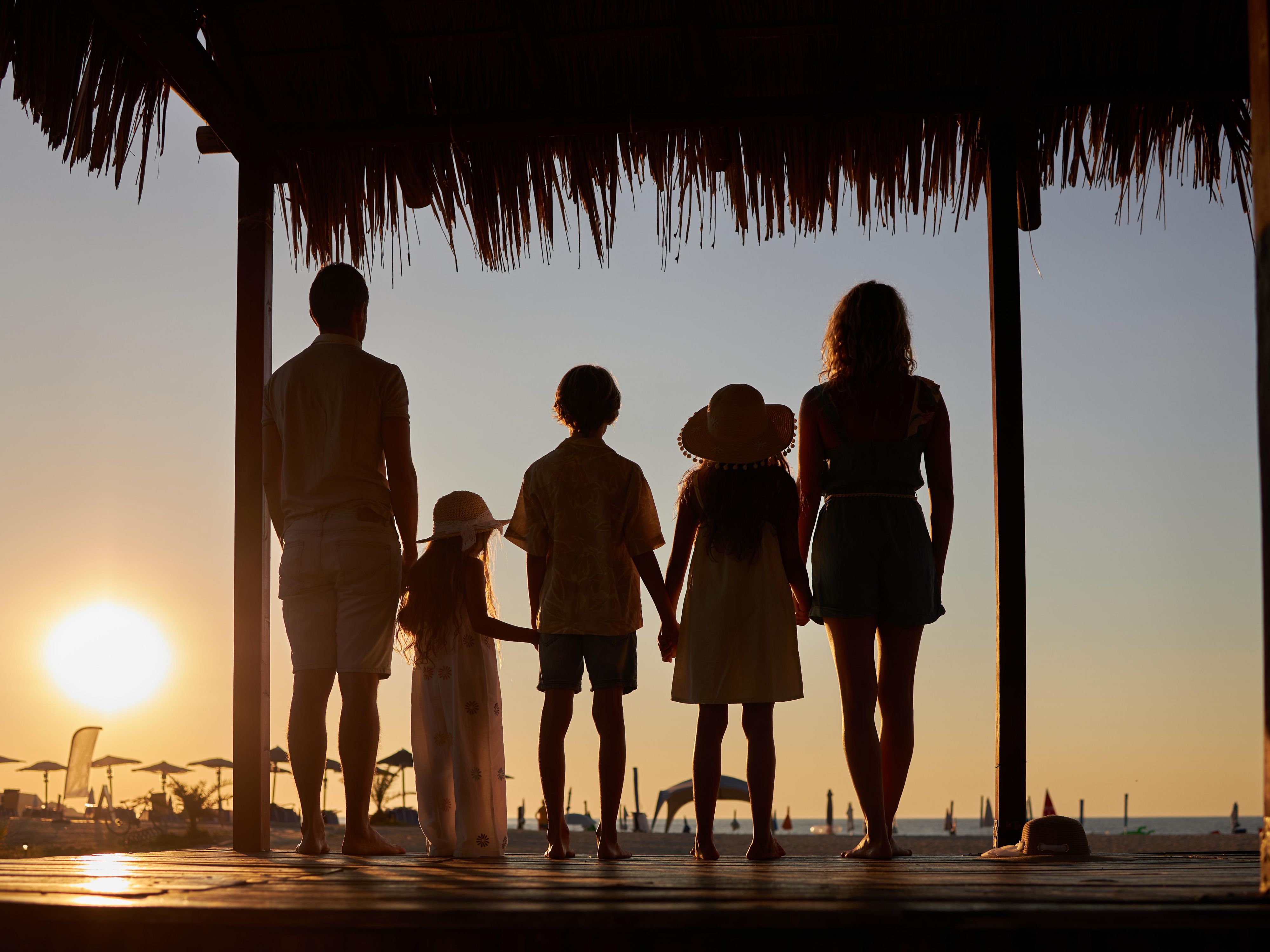 Family looking out at the sunset