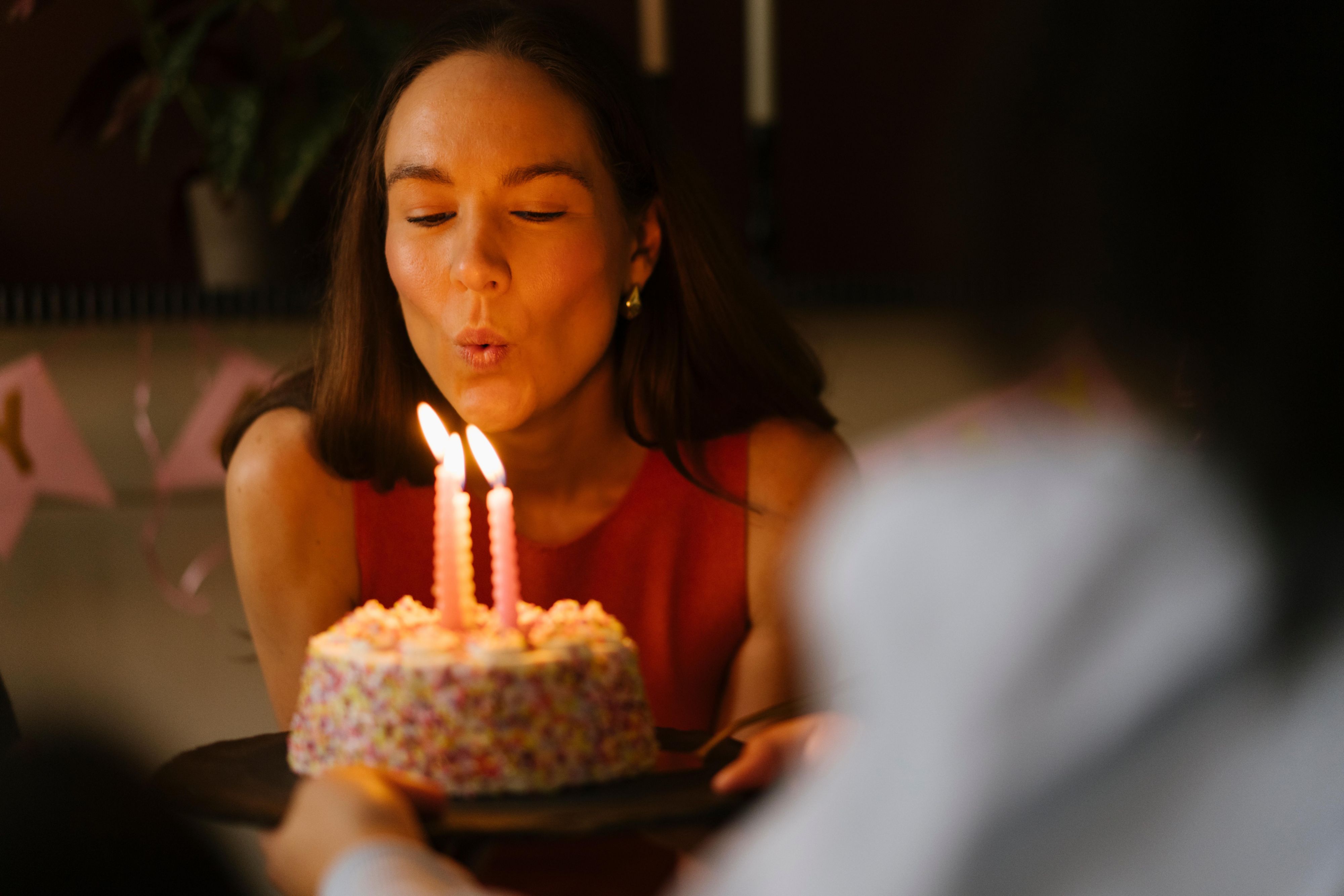 Blowing candles to a birthday cake