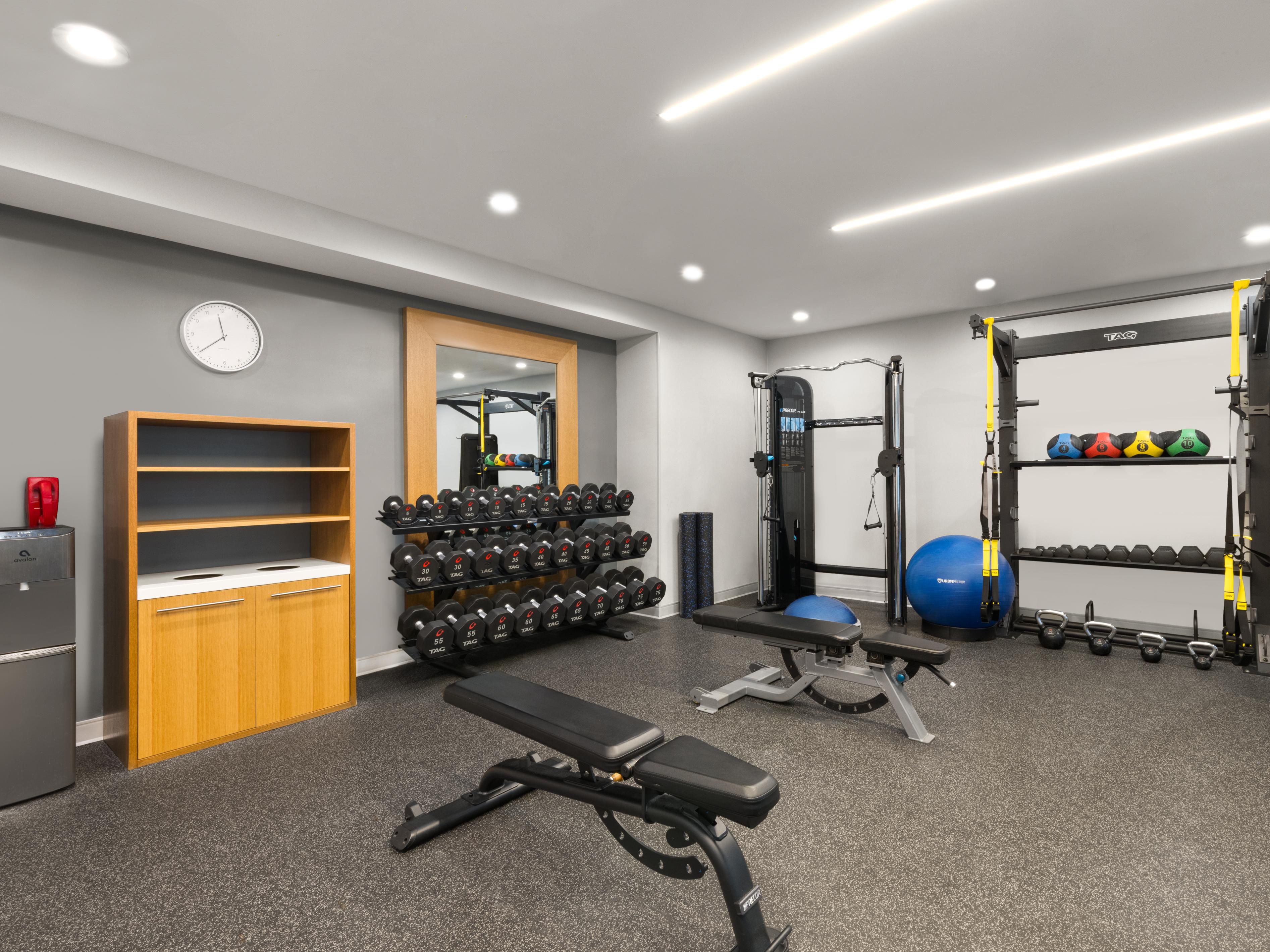 Fitness center with treadmills, weights, and training equipment.