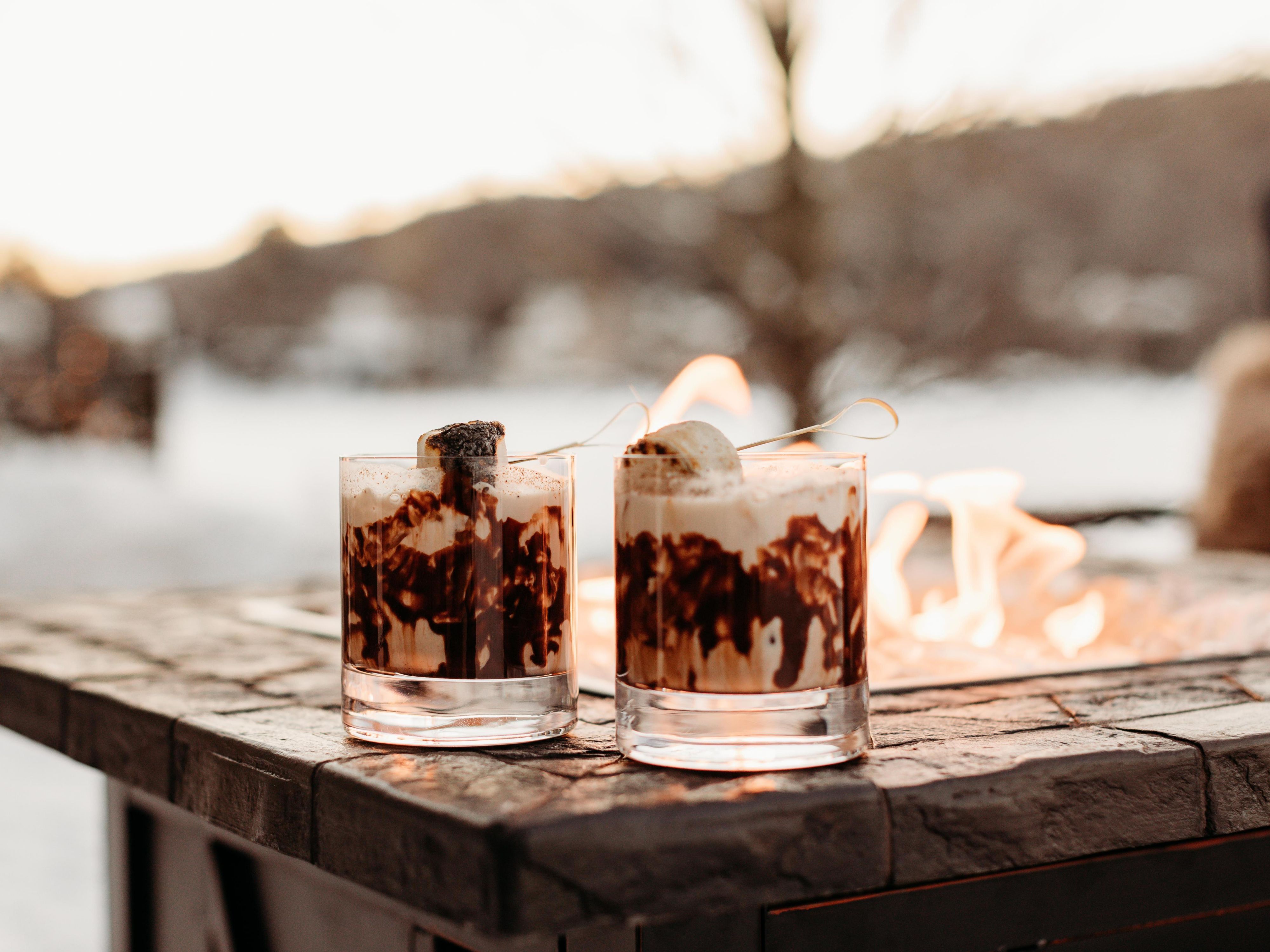 Enjoying the fire over some crafted cocktails