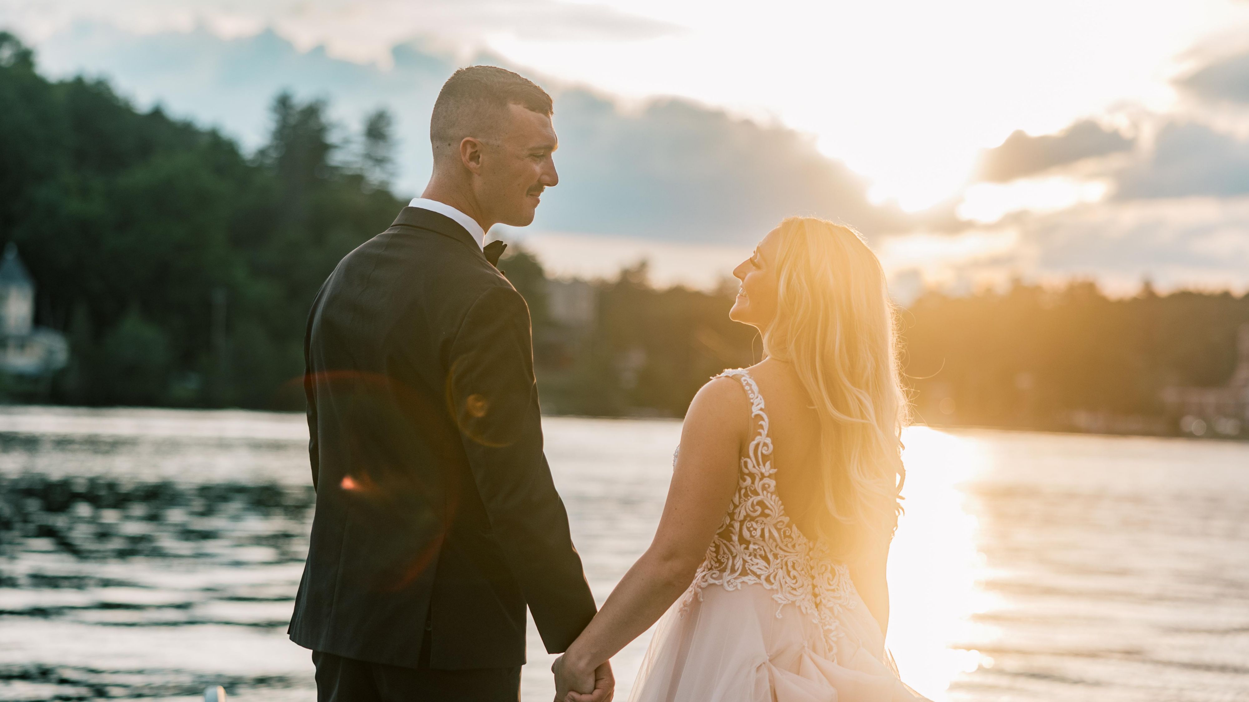 Couple holding hands at sunset