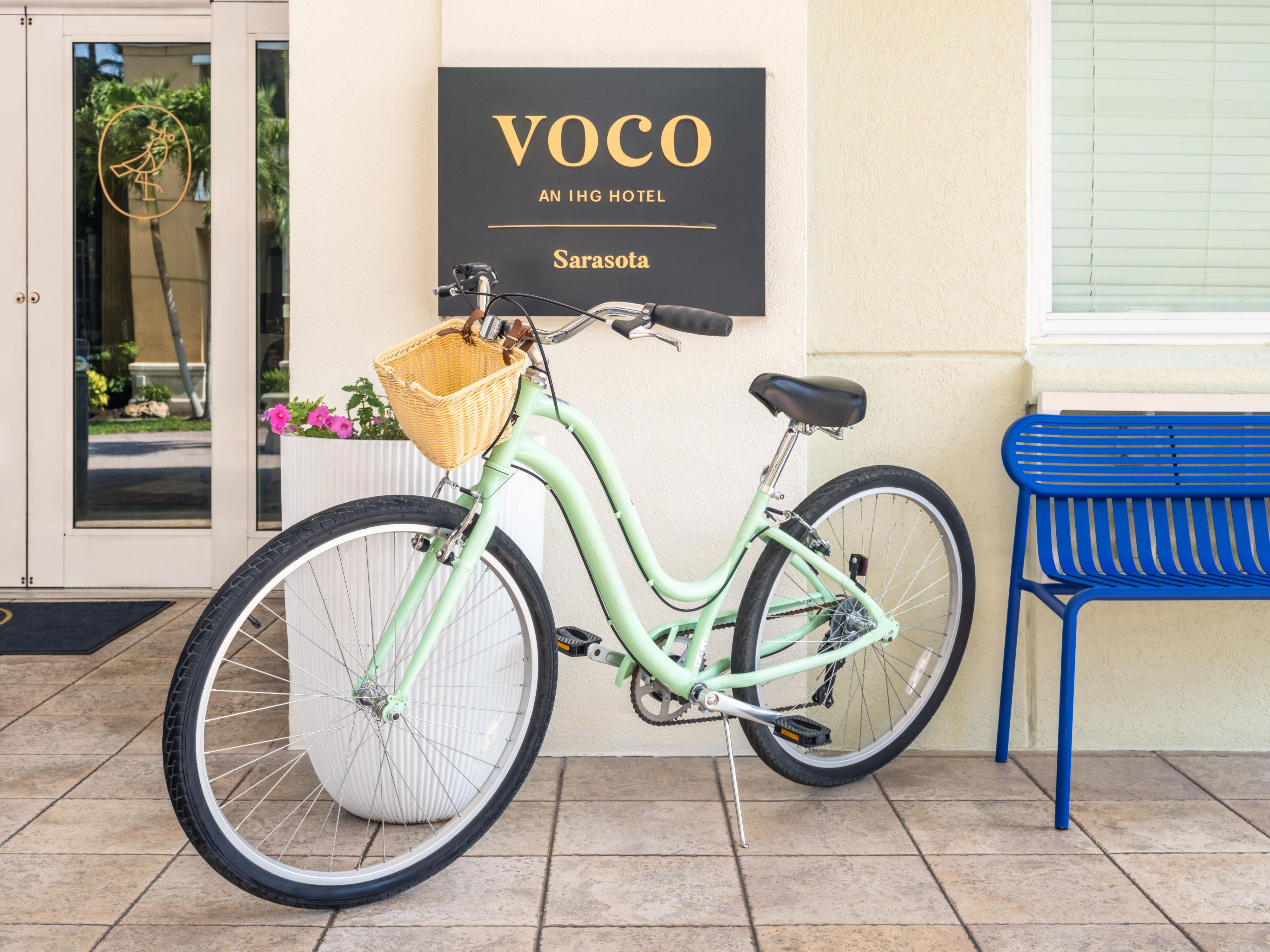 A bicycle in front of the voco Sarasota hotel entrance.