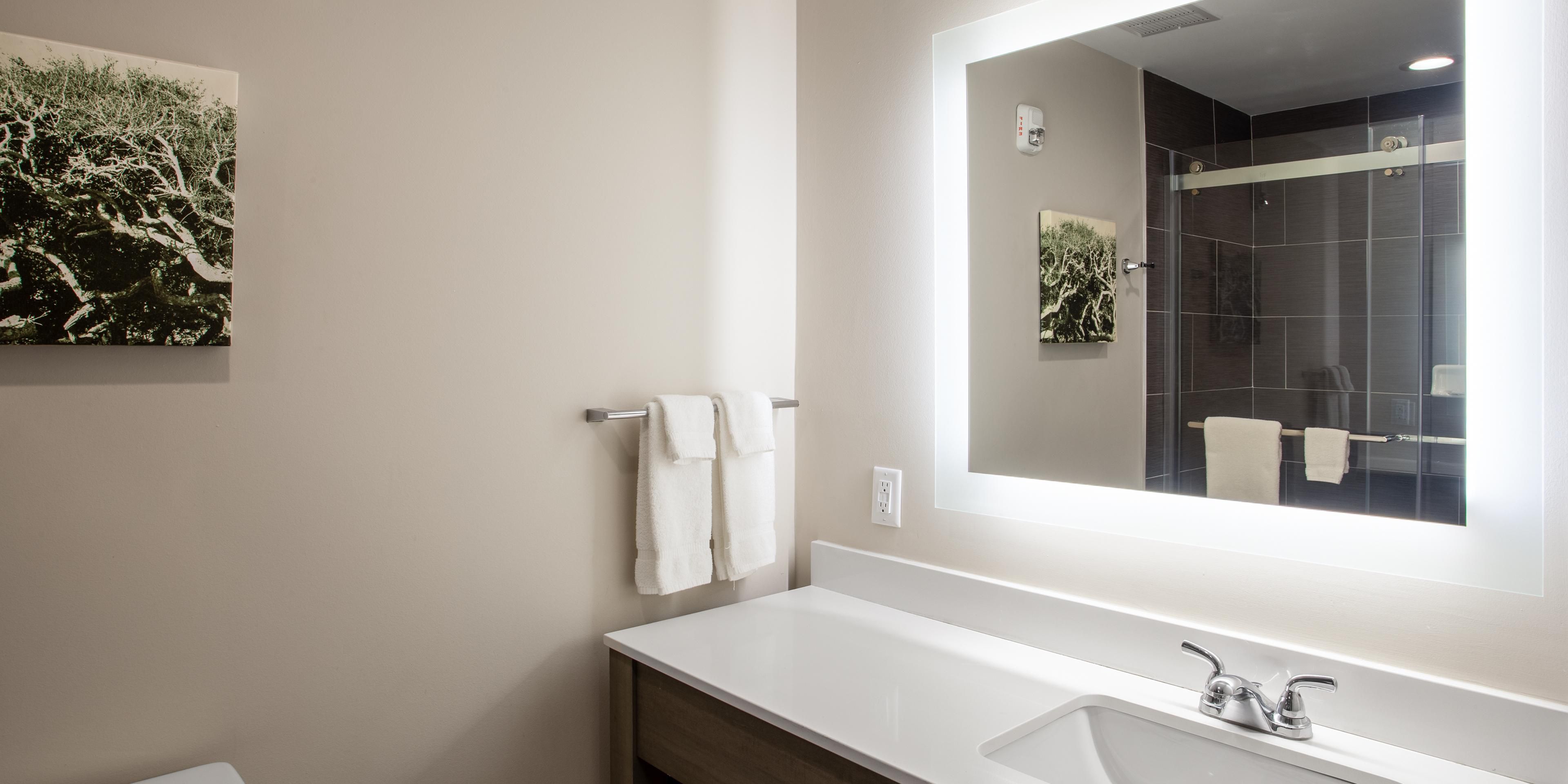 Guest bathrooms feature spa-inspired showers &amp; posh amenities.