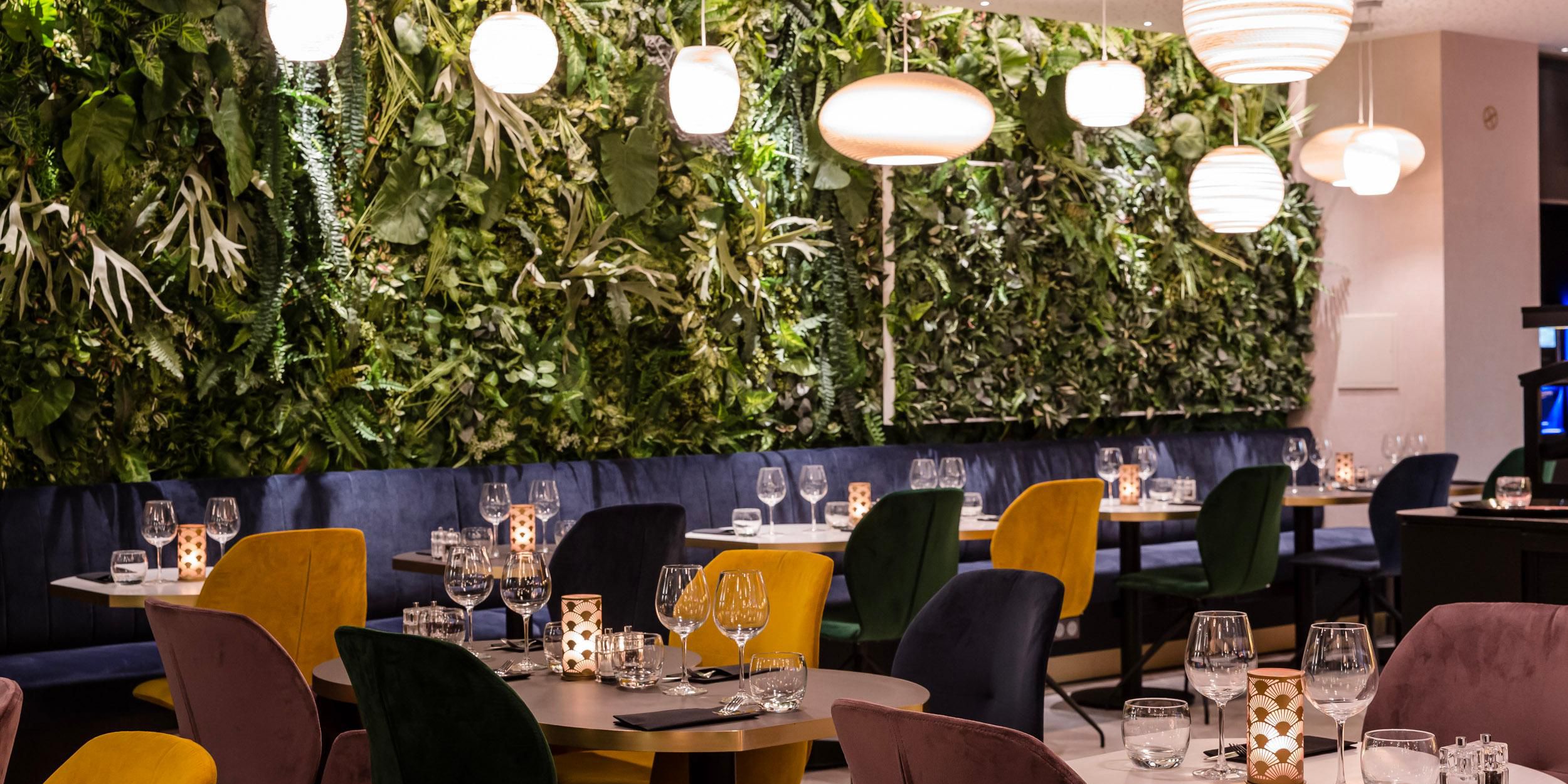 Our Garden restaurant, bathed in natural light, serves a breakfast buffet featuring pastries, fresh fruits, and local specialties. Enjoy homemade lunch and dinner dishes inspired by global flavors. The Lounge Bar offers wines and cocktails, with leafy terraces ideal for outdoor dining.