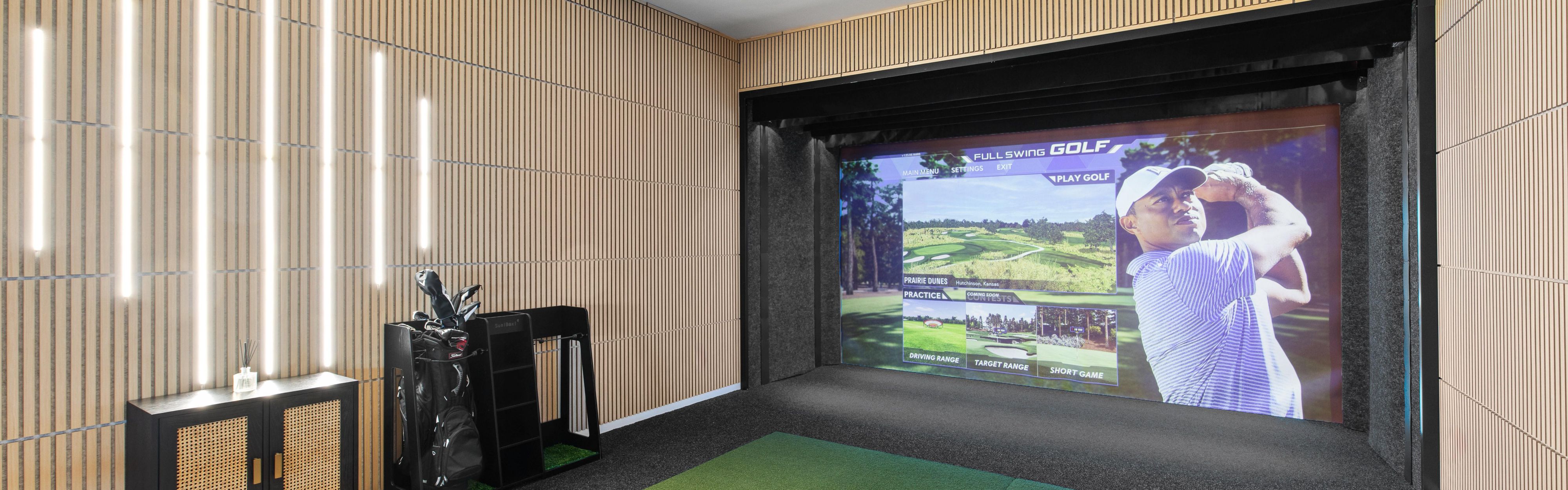 Indoor golf simulator near hotel lobby and Verde restaurant.