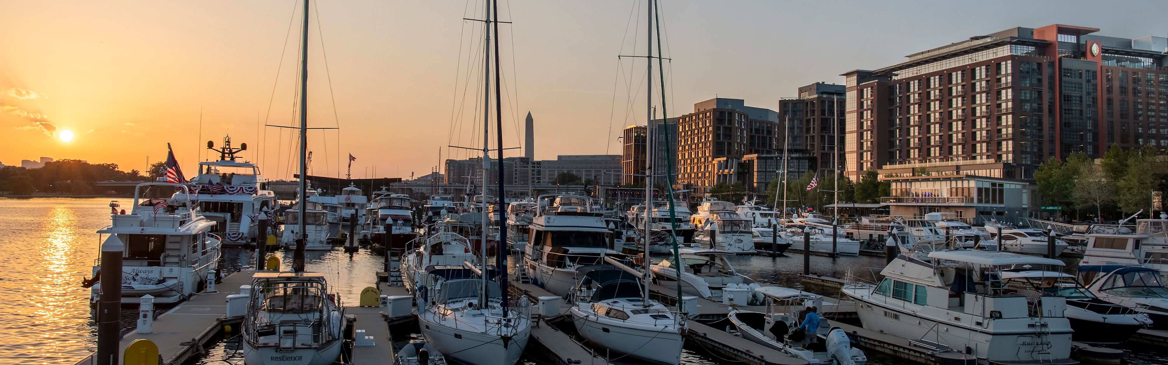Boats docked at The Wharf marina at sunset near D.C.