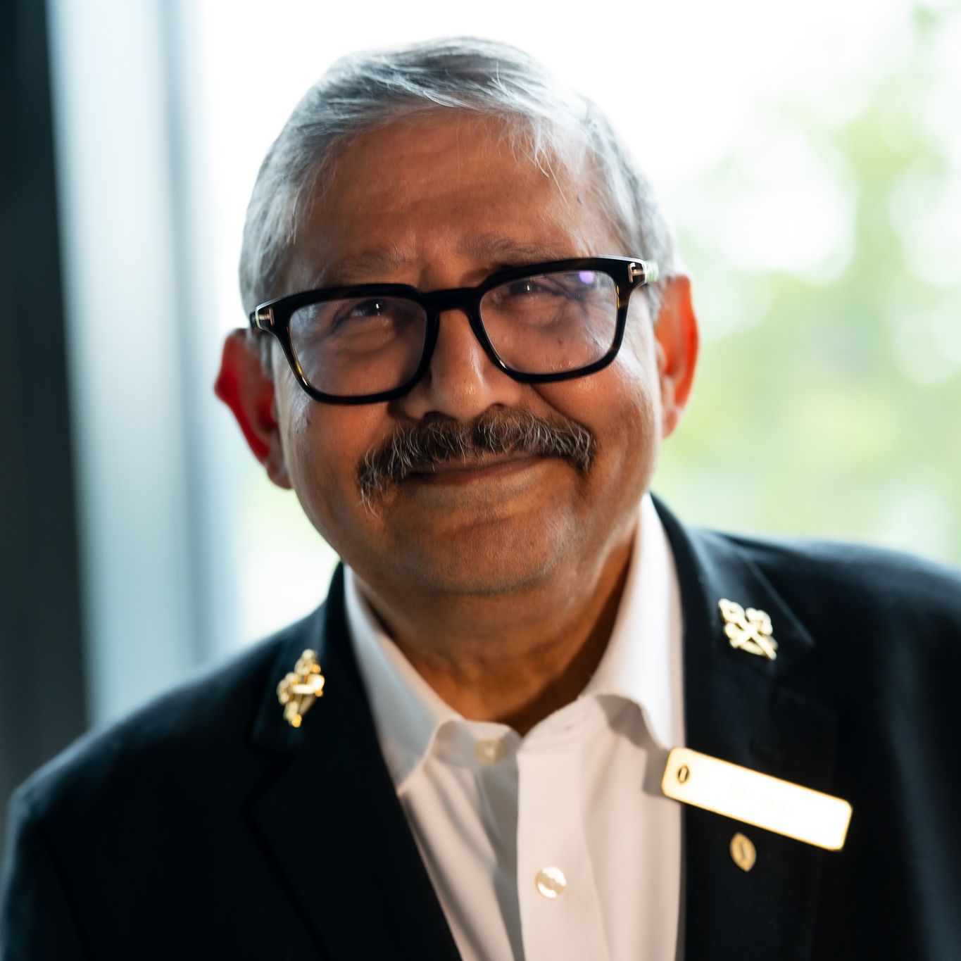 Shujaat Khan, Chef Concierge, portrait in hotel attire