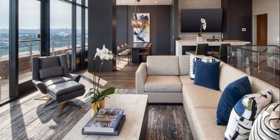 Constellation Suite open living and dining area with terrace views of the water and Jefferson Memorial.
