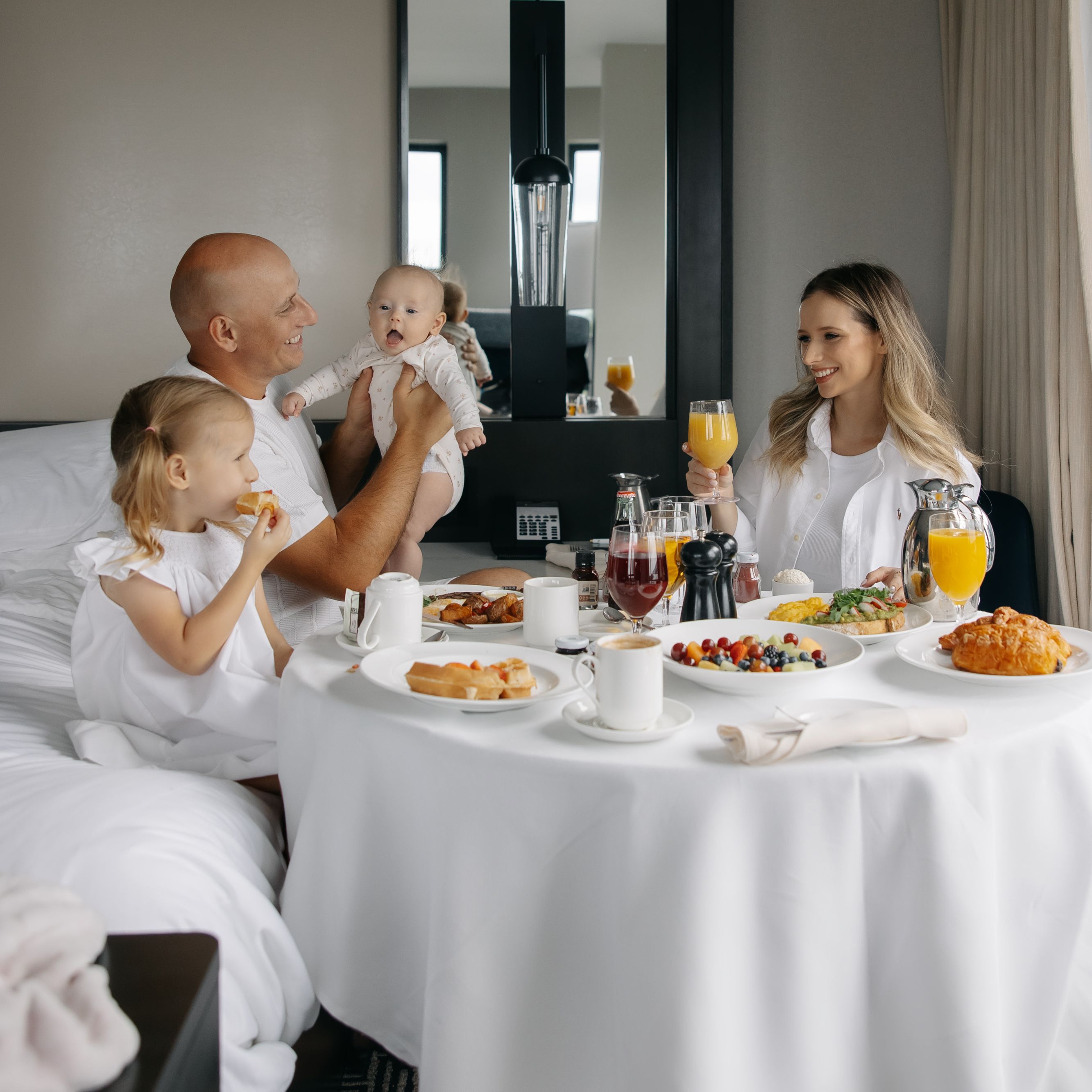 Family enjoying in room dining.