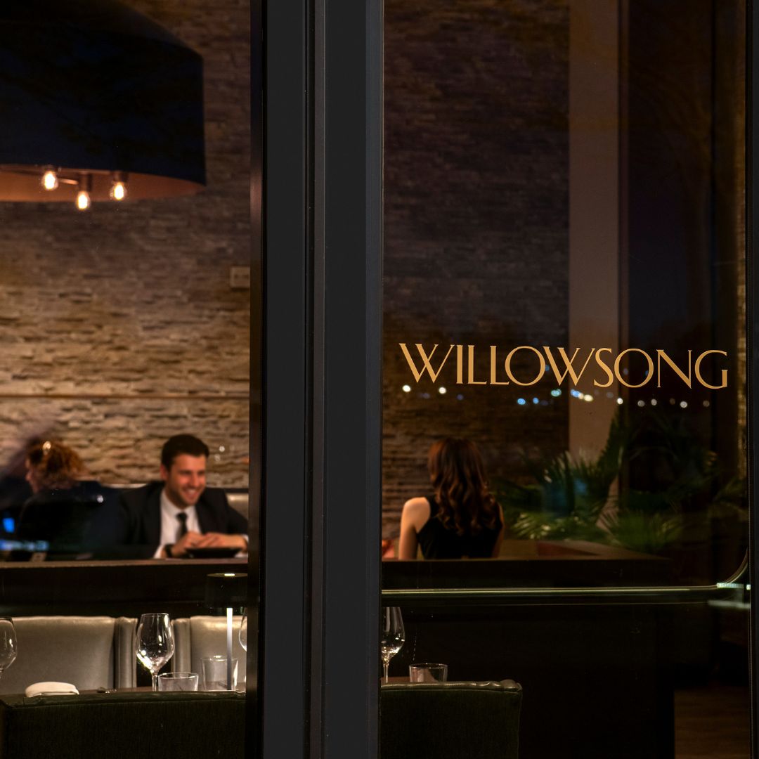 couple enjoying romantic date night dinner at Willowsong restaurant